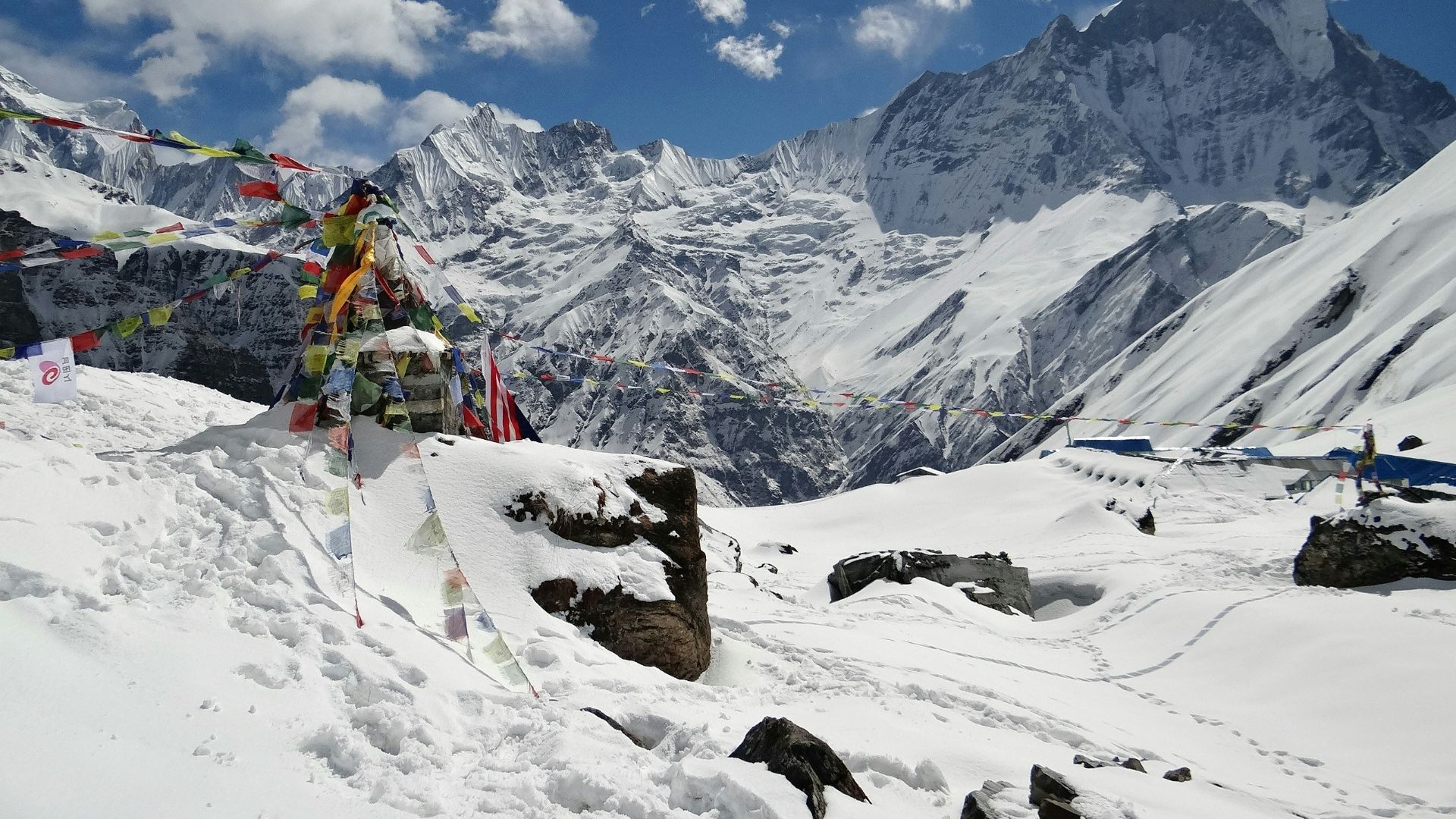 a mountain covered in snow under a blue sky