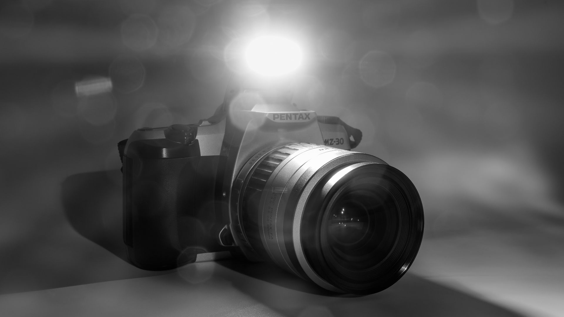 File:The built in flash of a SLR camera, Pentax MZ-30, firing 1.jpg