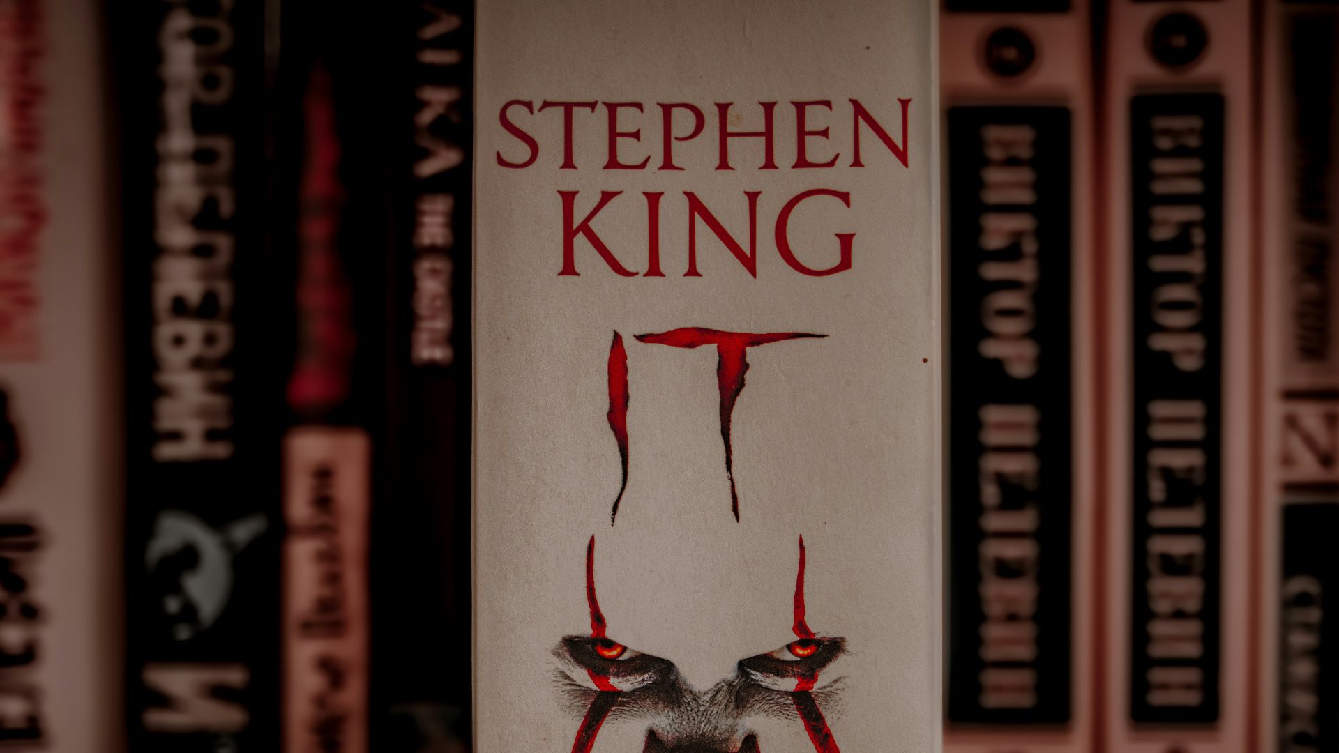 A book with a creepy clown face on it