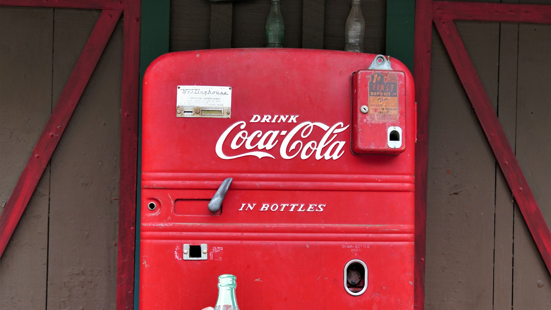 coca cola soda bottle on red coca cola vending machine