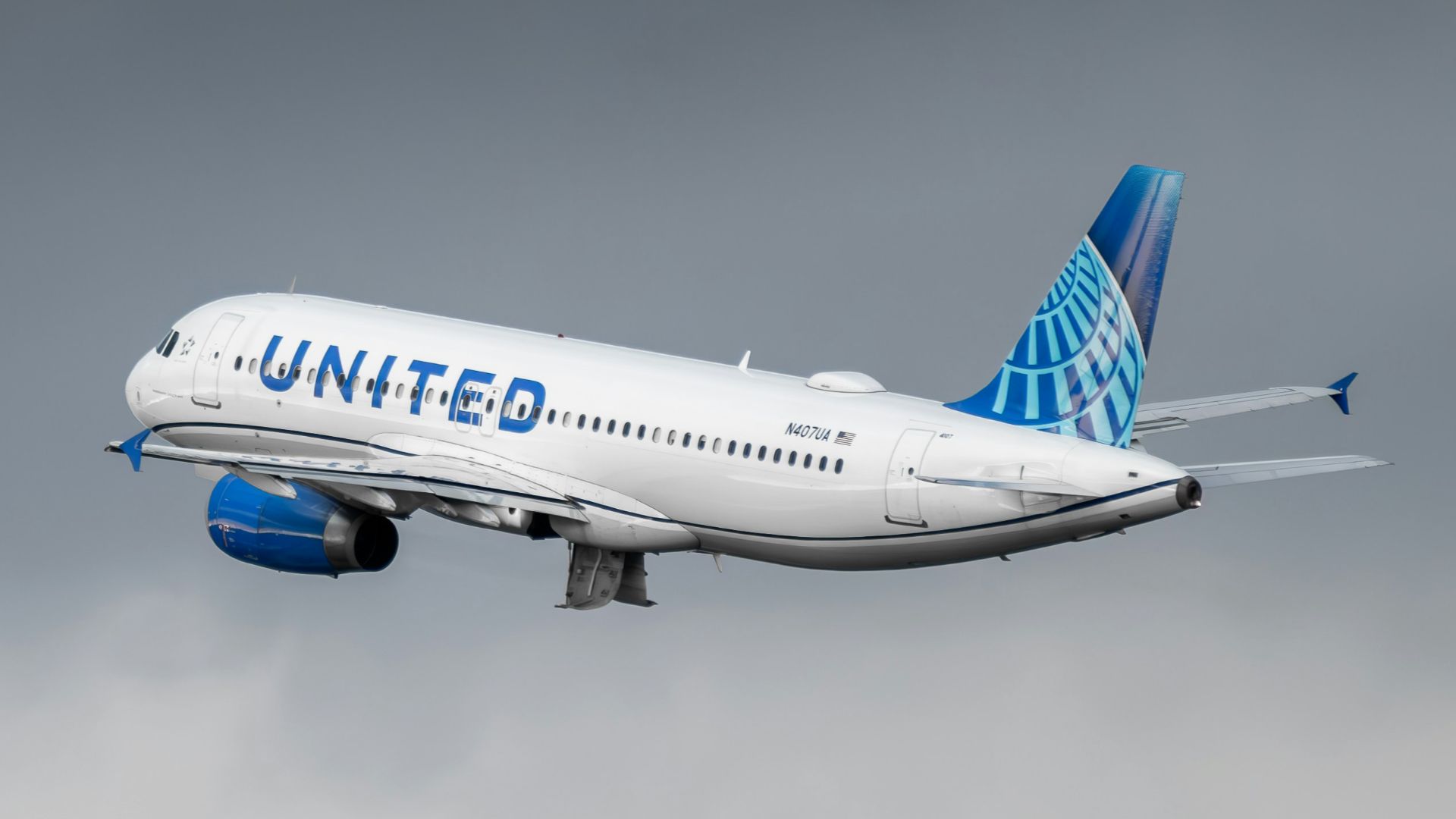 a united airlines plane flying in the sky