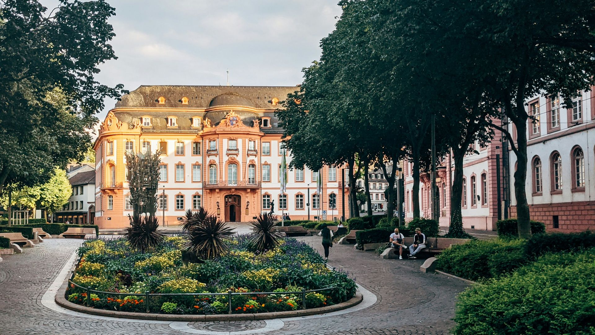 green trees near brown concrete building during daytime