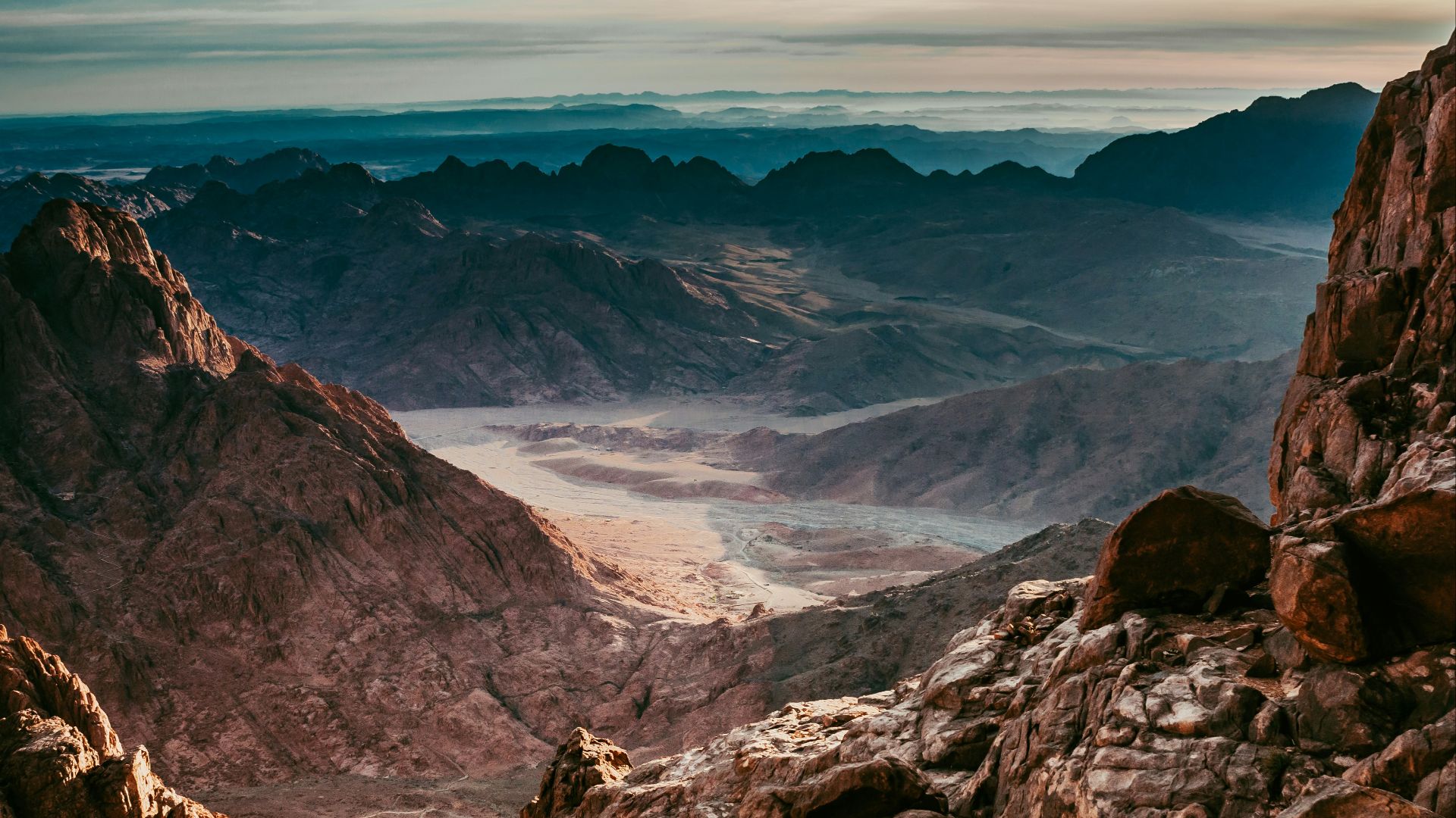 aerial photography of desert under blue and white sky during daytime