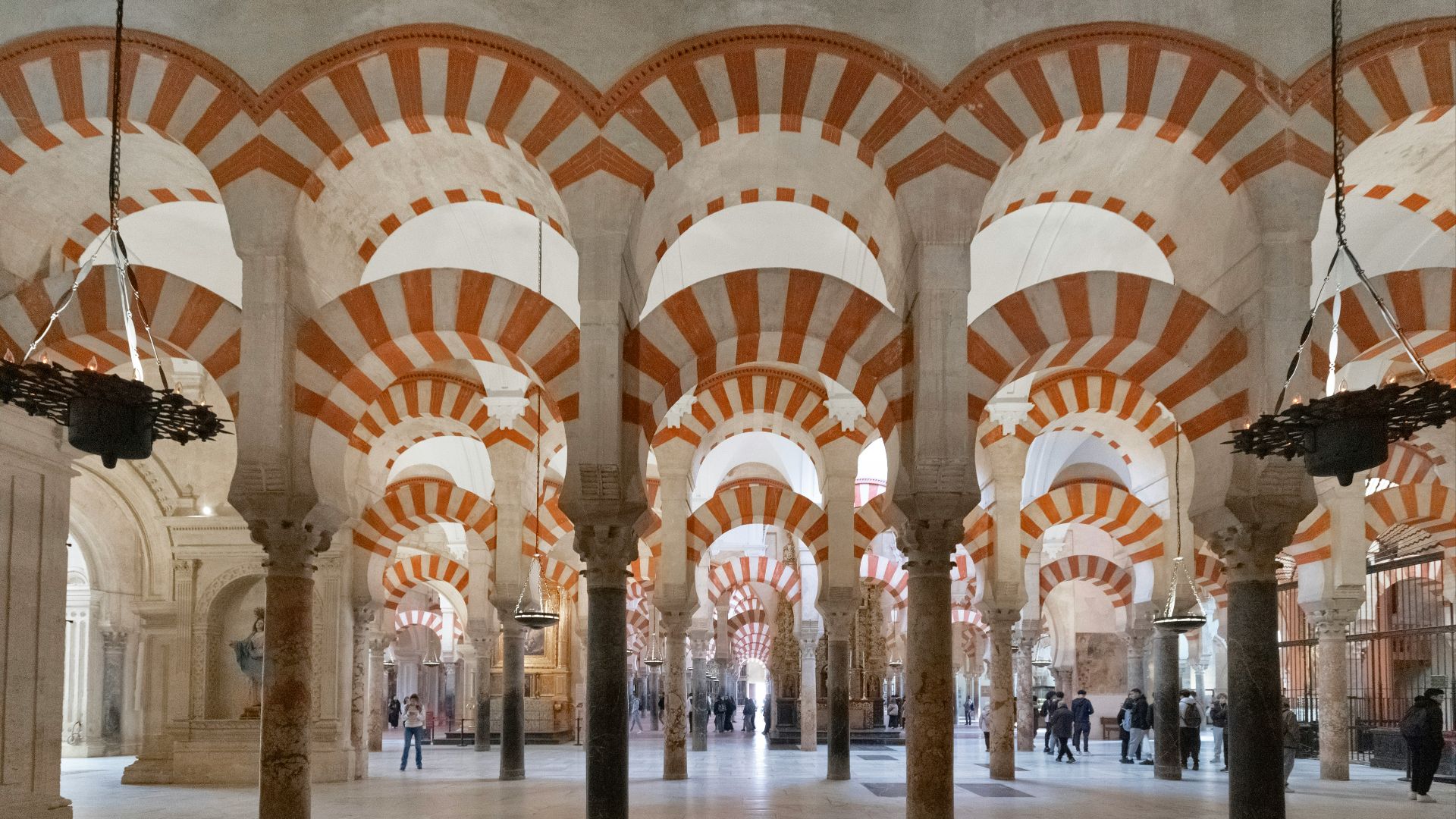 A large room with many pillars and arches