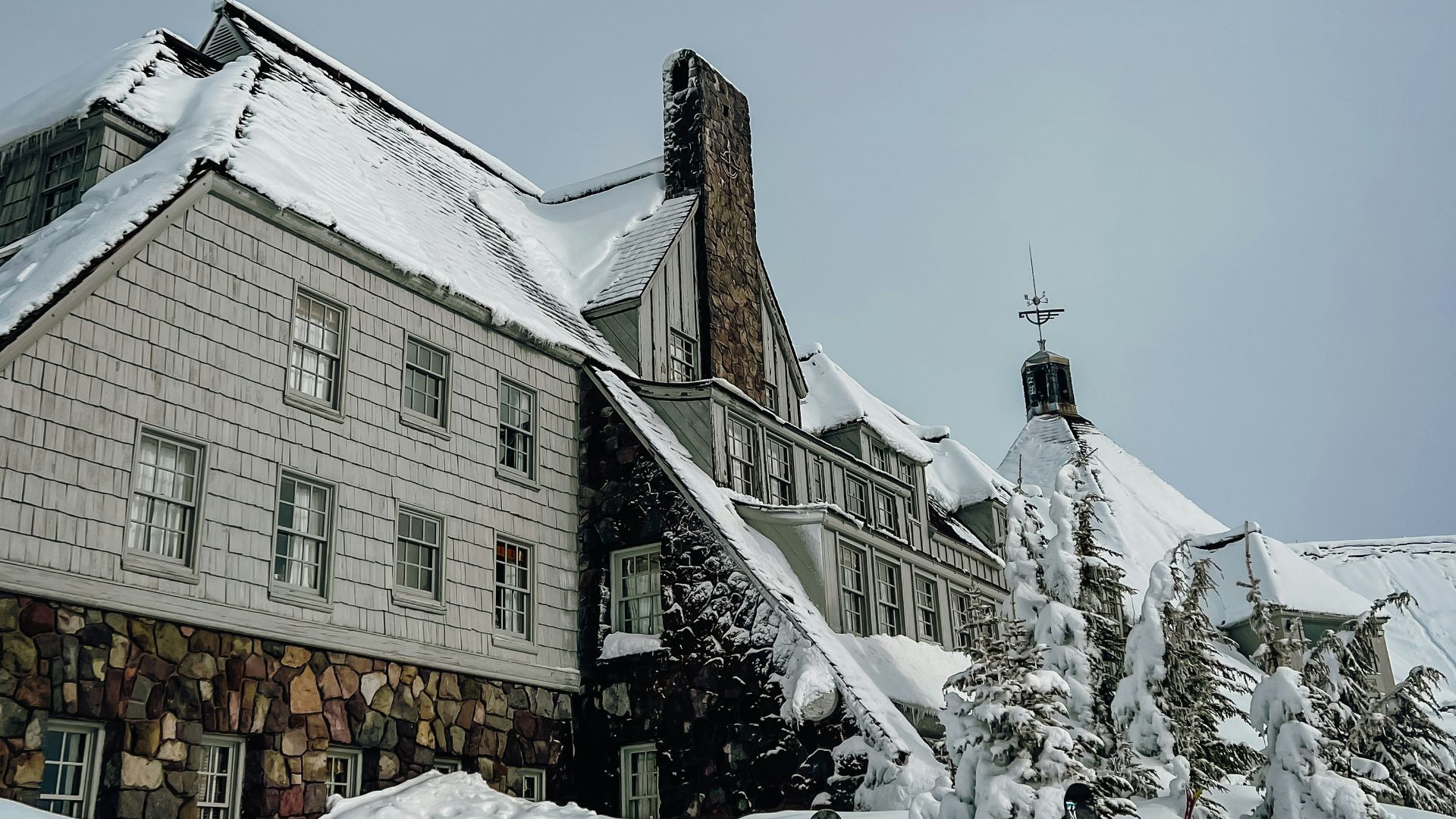 a house with a lot of snow on the ground