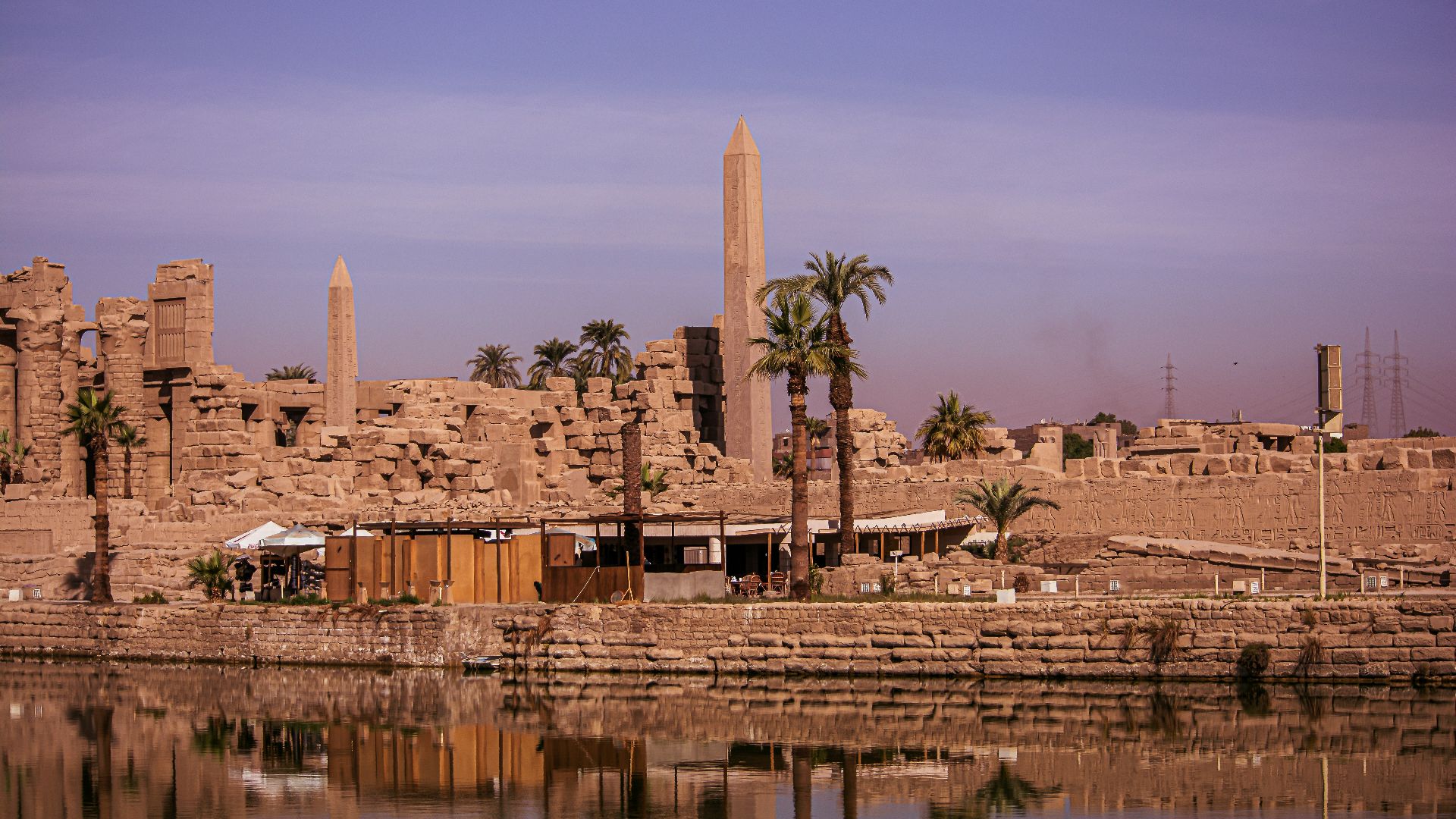 brown concrete building near body of water during daytime