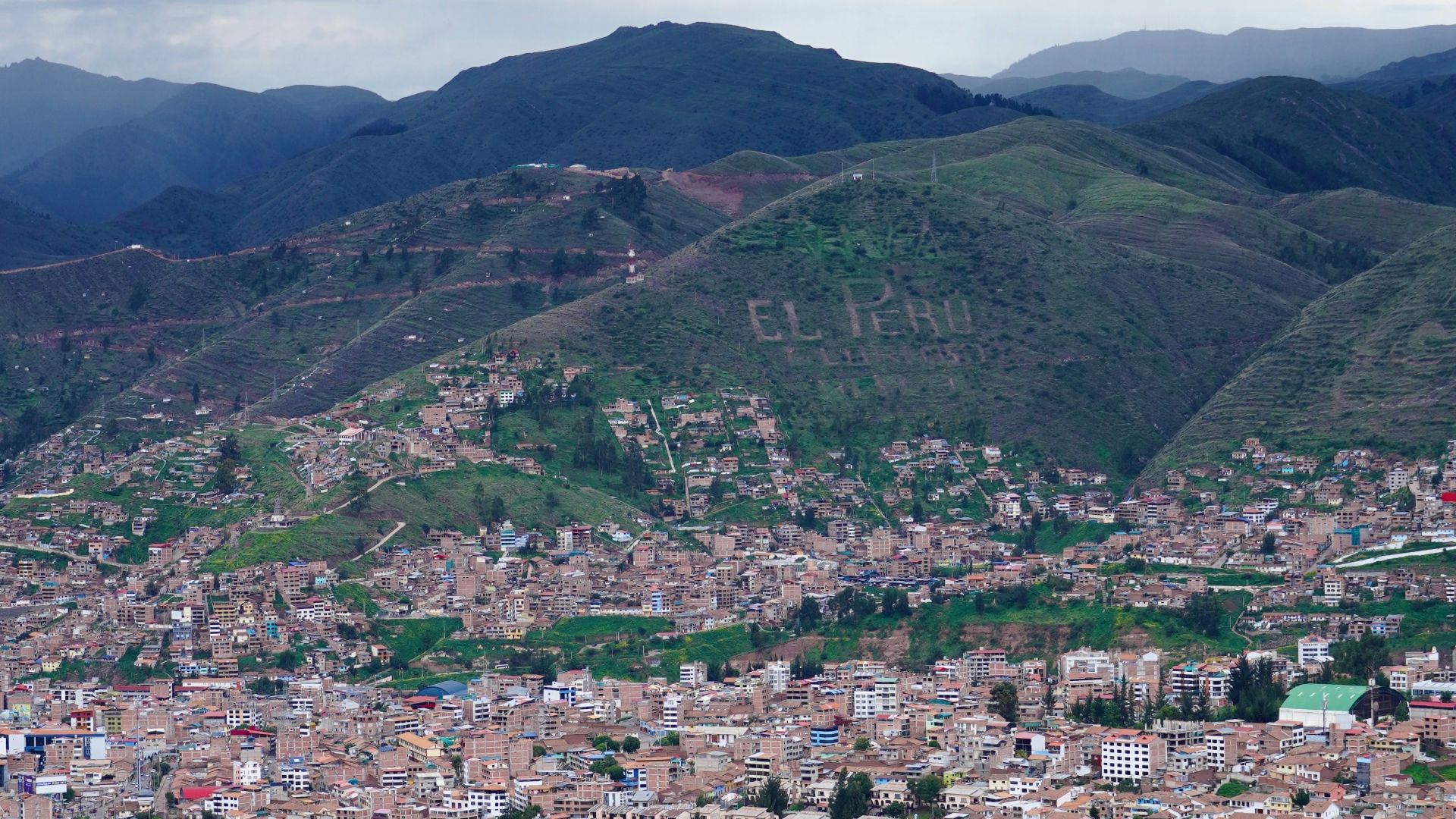 A view of a city with mountains in the background
