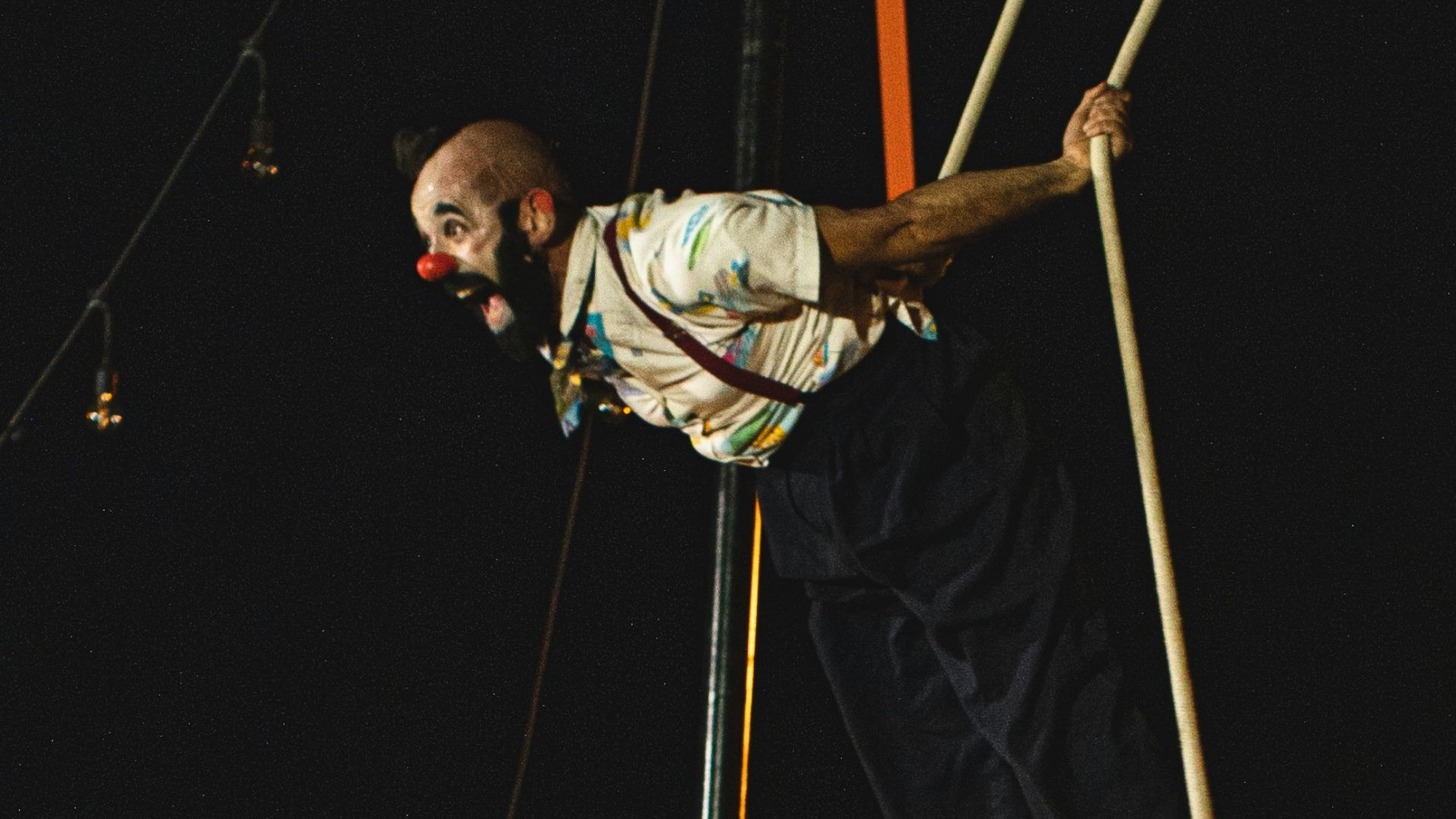 two men doing tricks on a rope course