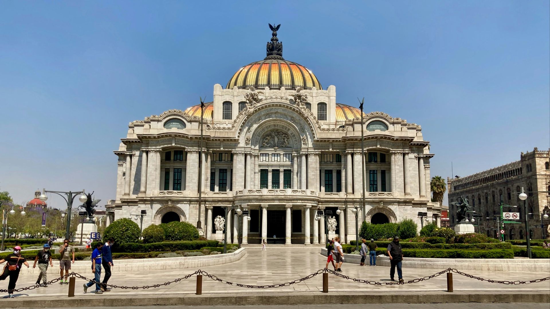 people walking near white concrete building during daytime