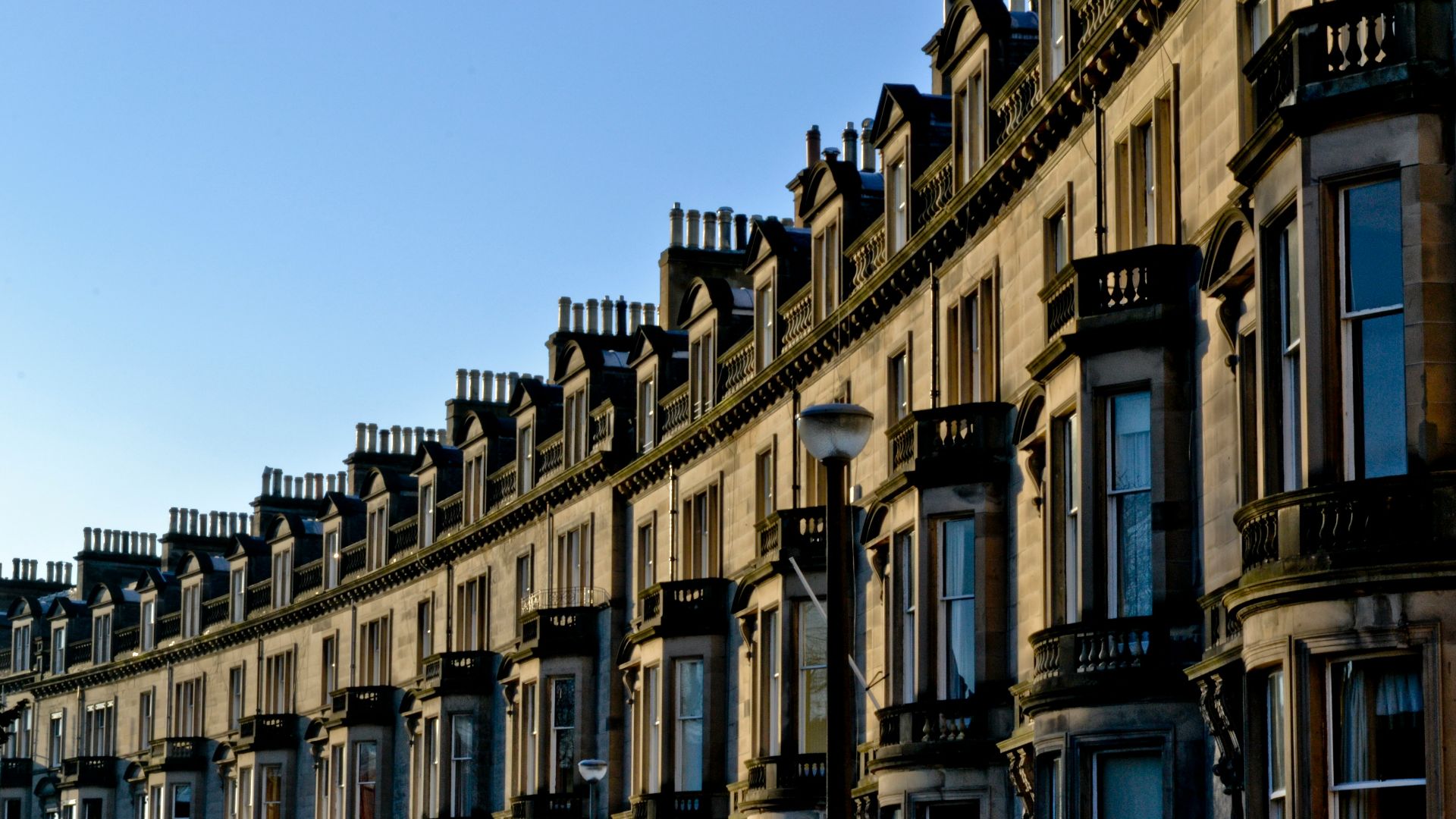 white and black concrete building under blue sky during daytime