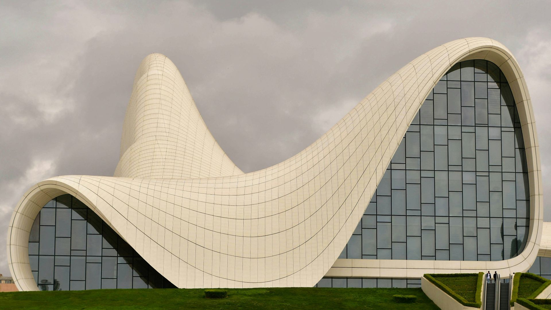 a large white building with a curved roof