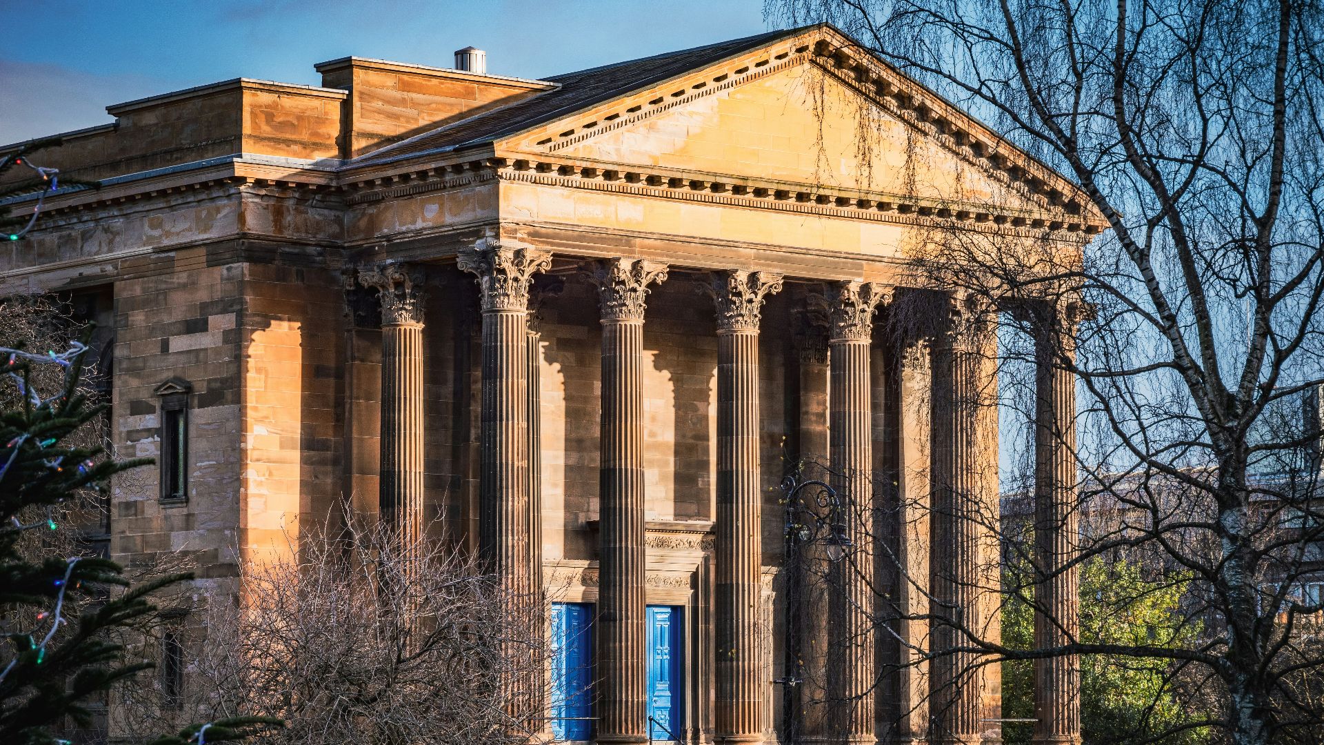 a large building with columns and a clock tower