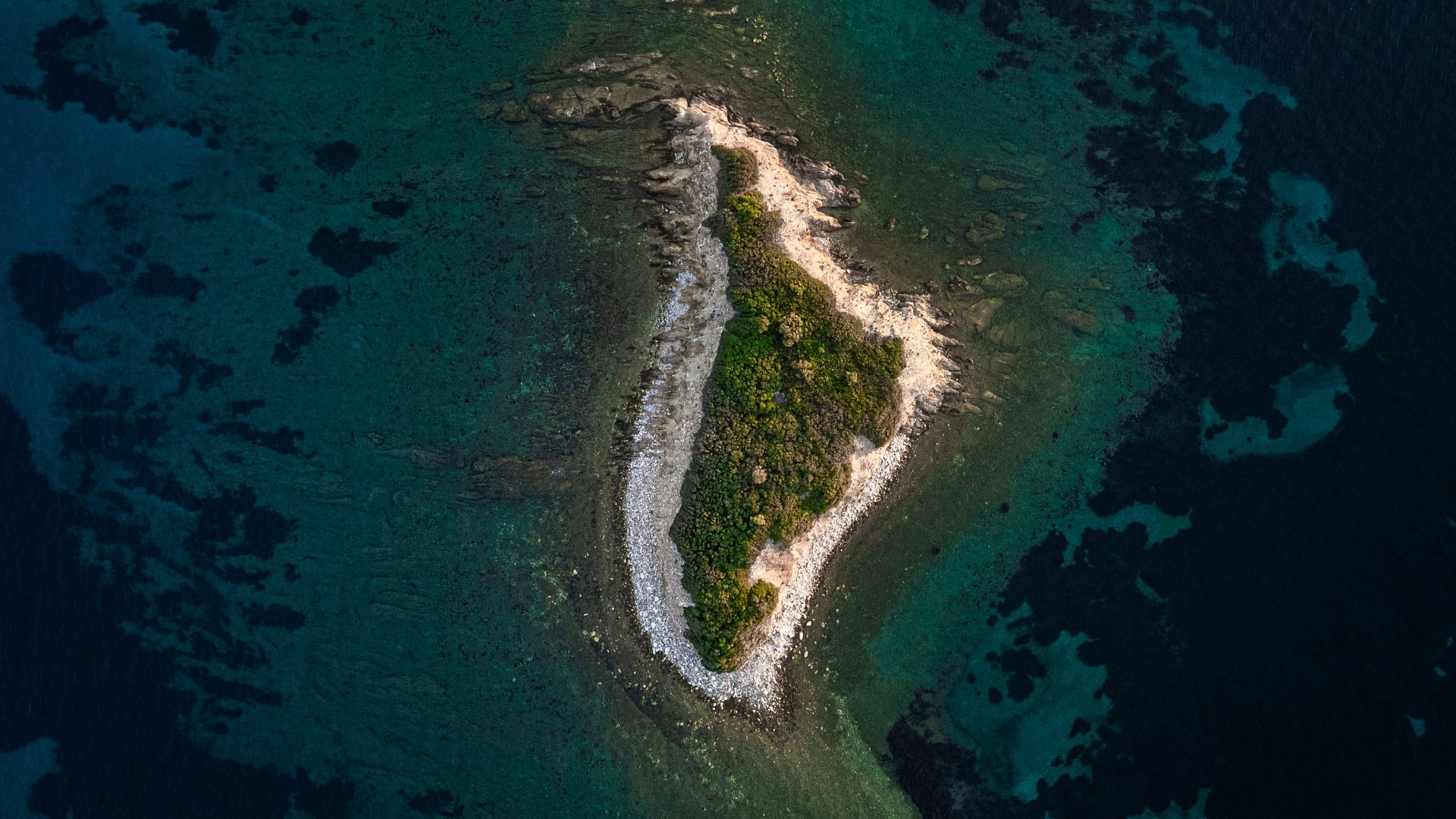 An aerial view of a small island in the middle of the ocean