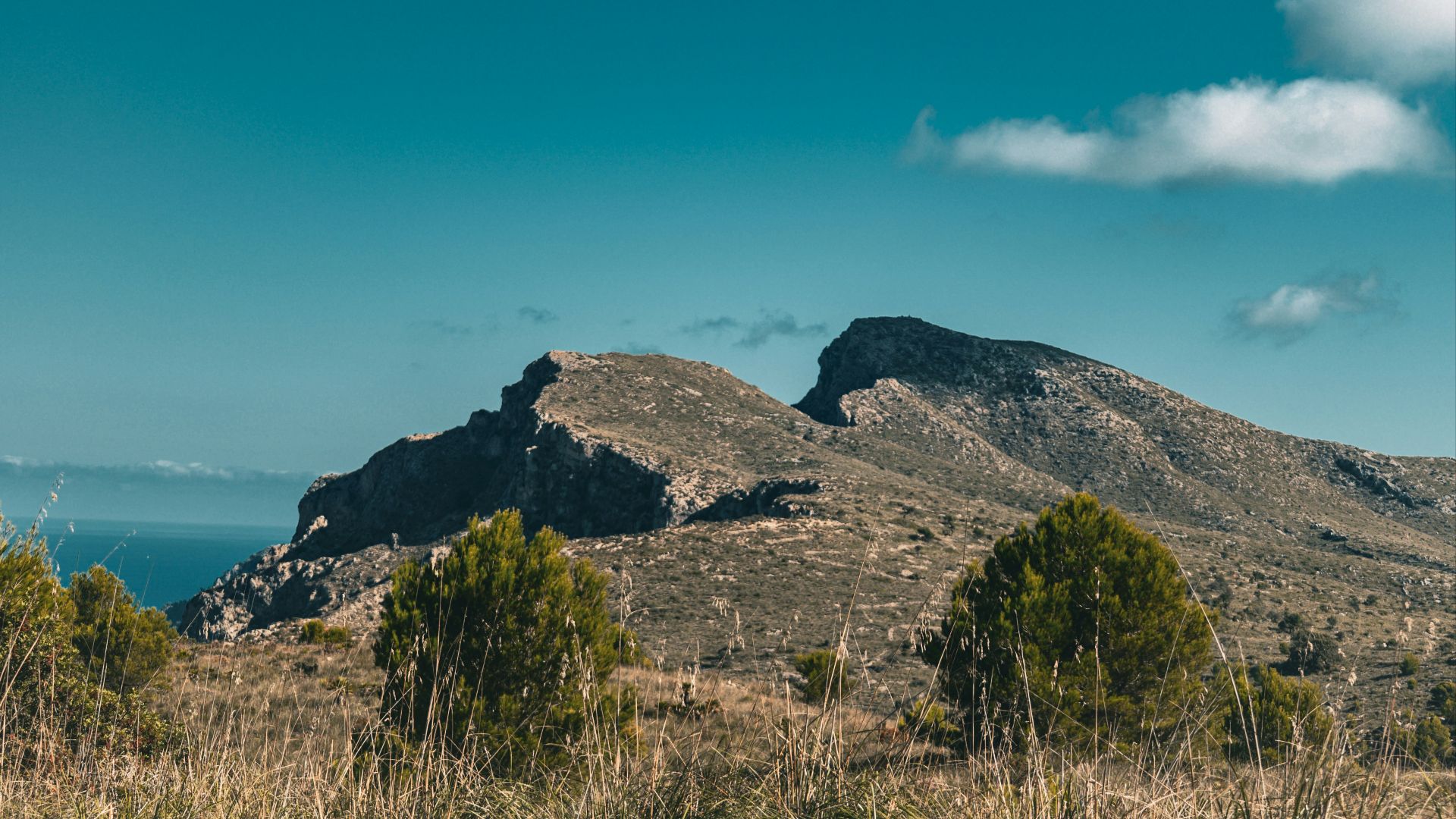 A view of a mountain range from a distance