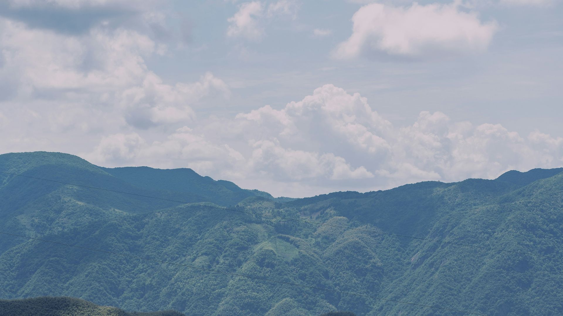 A view of a mountain range from a distance