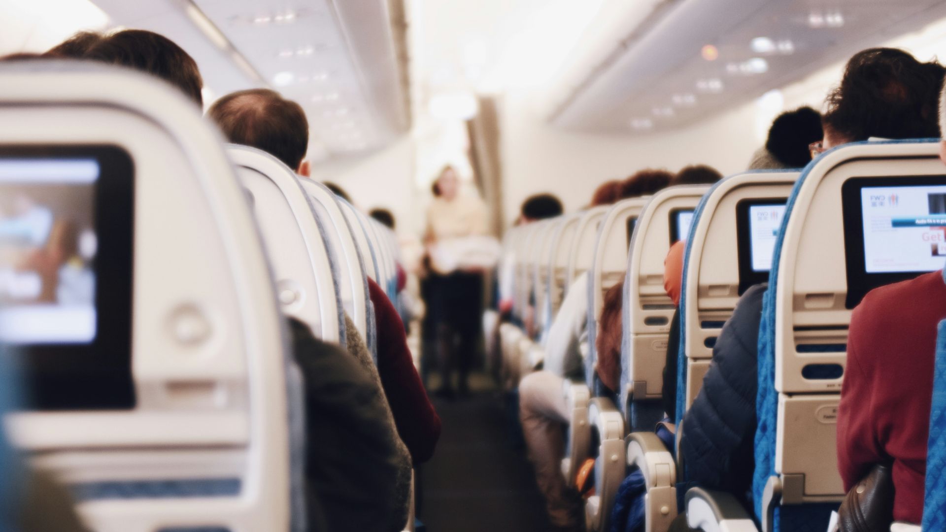 shallow focus photography of people inside of passenger plane