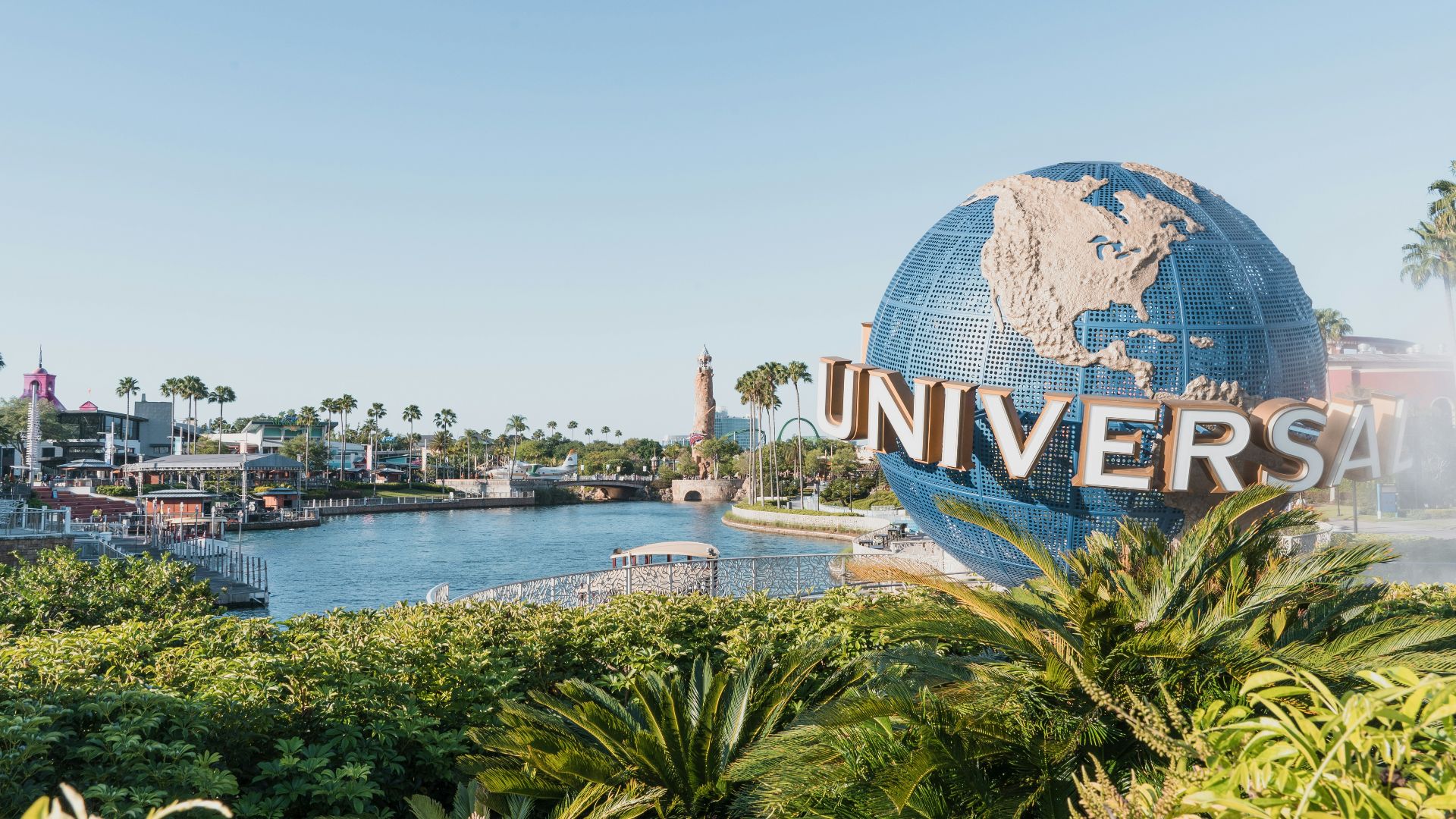 blue and white globe near body of water during daytime