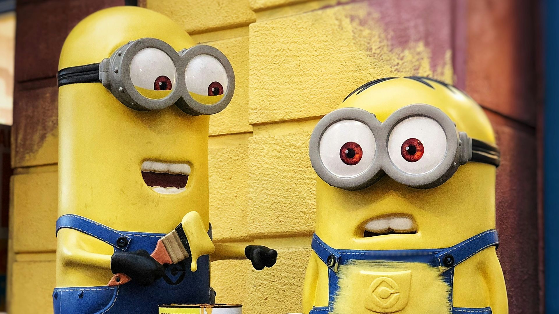 two Minions character figure on red table