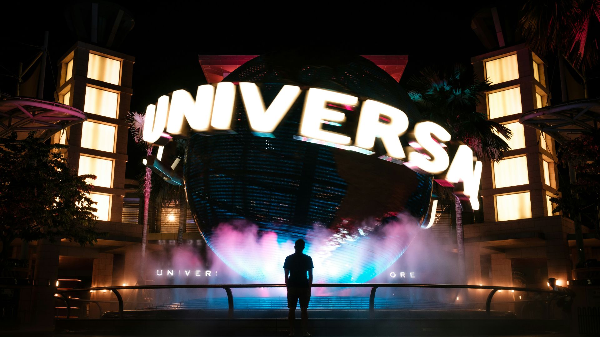 man standing in front of Universal Studio