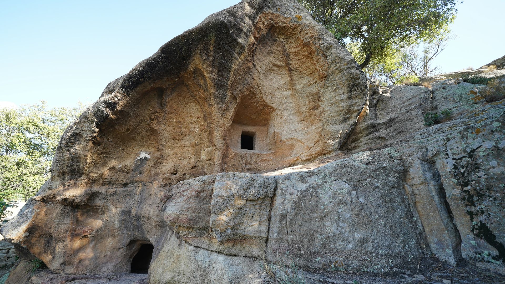 a cave built into the side of a mountain