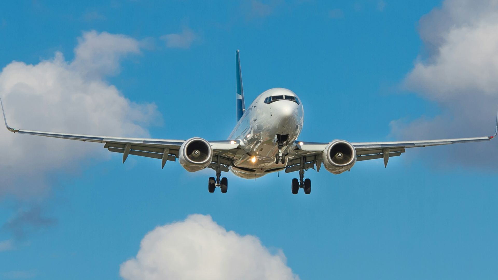 white airplane on mid air