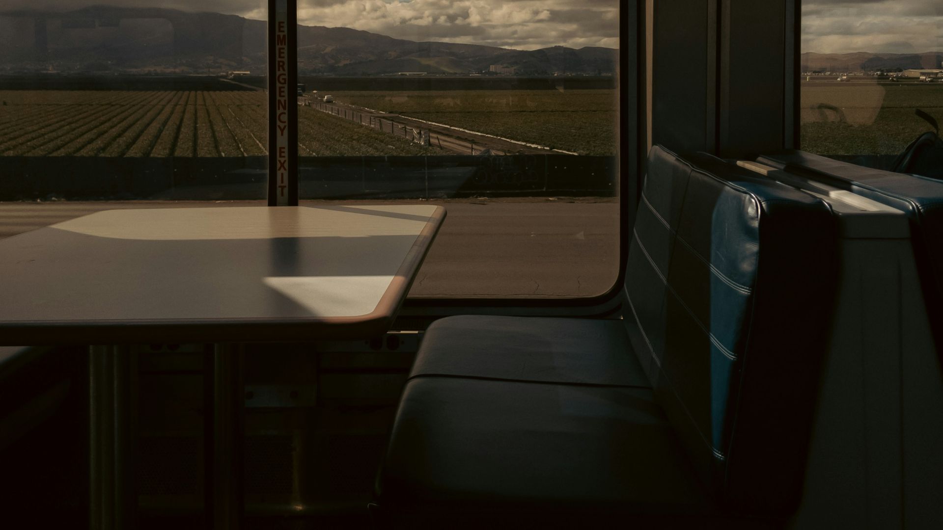 a table and chairs in a train car