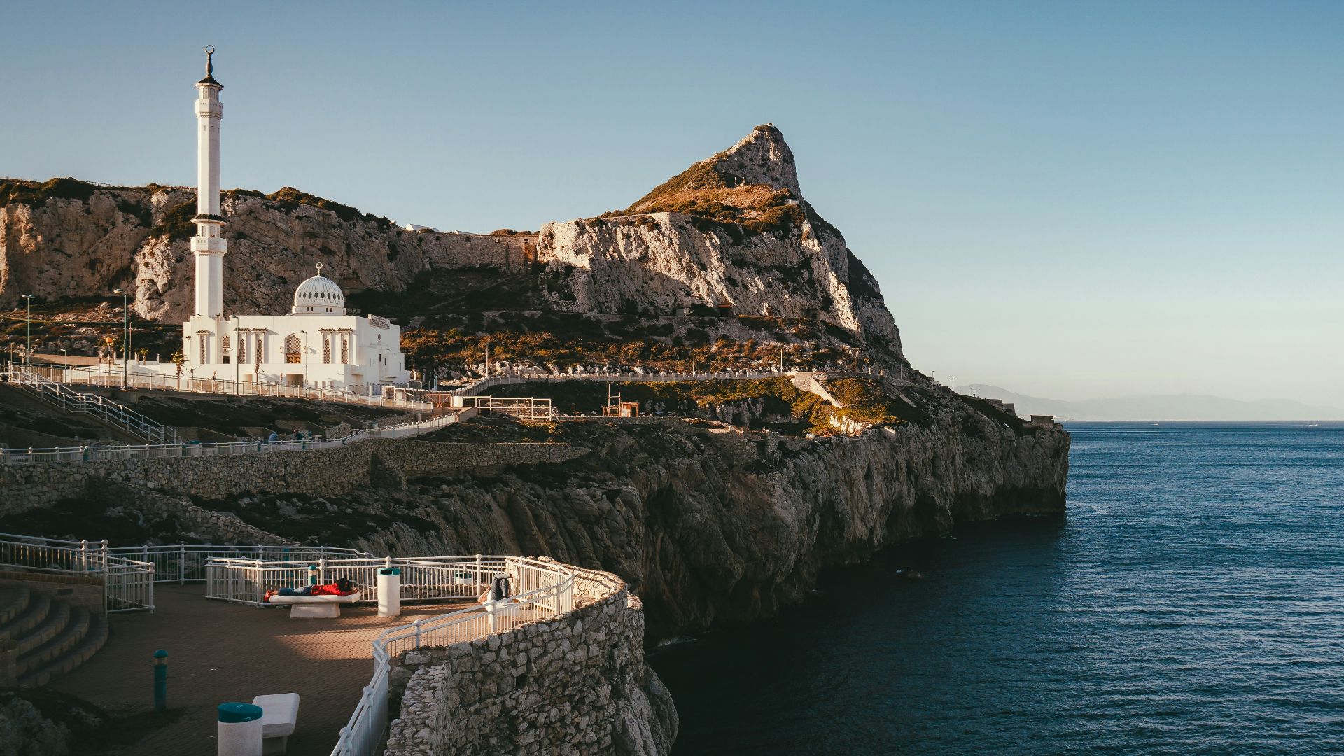 brown rocky mountain beside beach