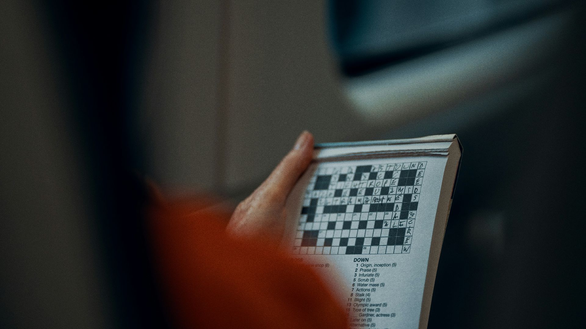 person holding white and black paper