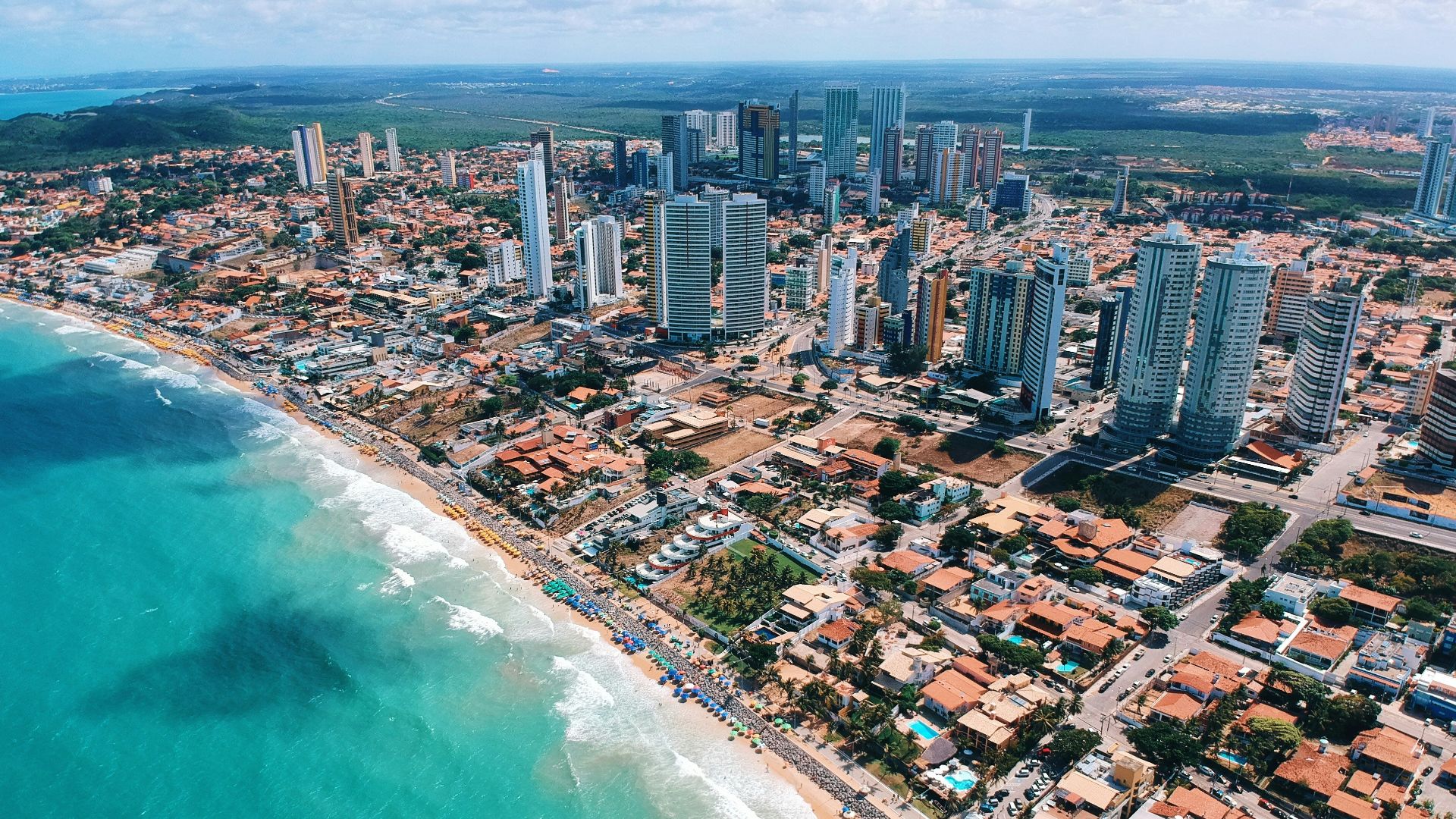 aerial photography of city building near the seashore during daytime
