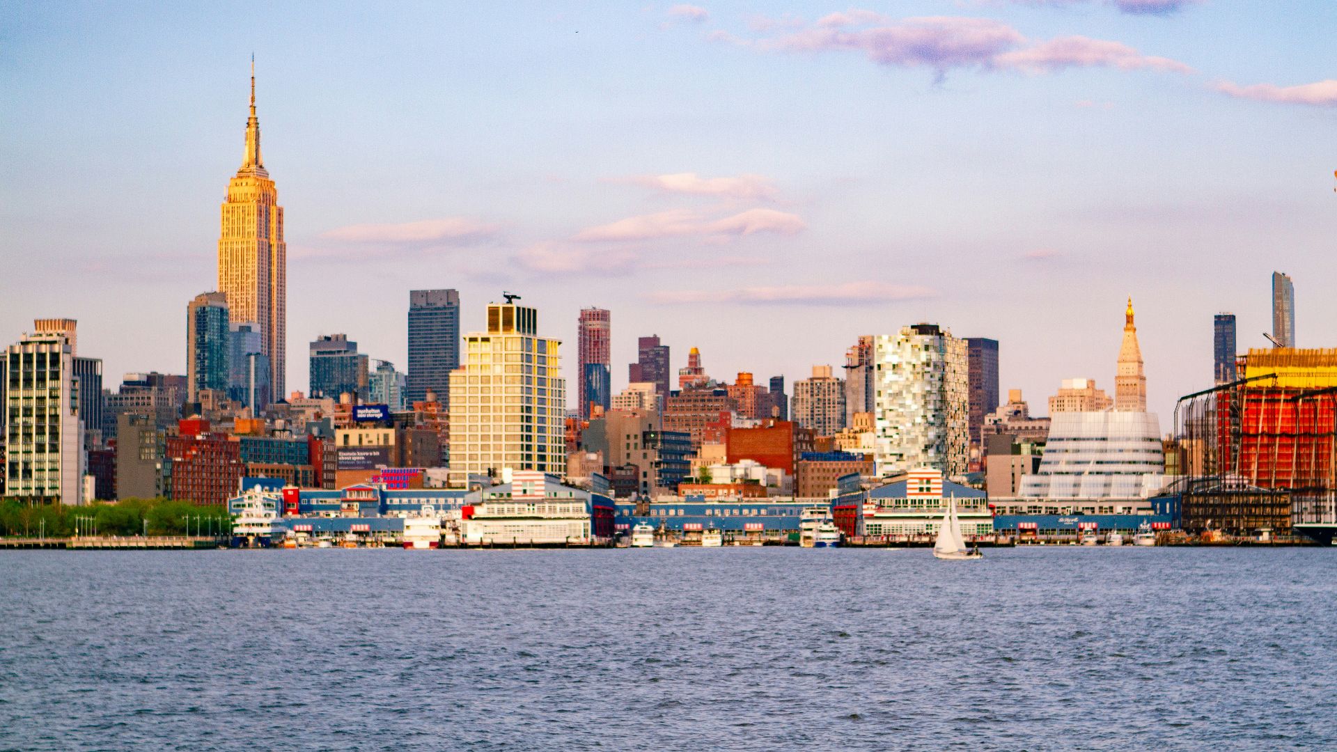city skyline across body of water during daytime