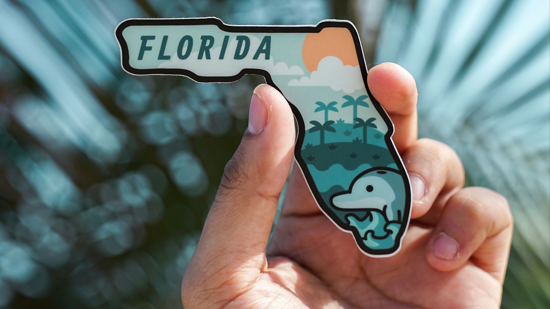 person holding white and black iphone case