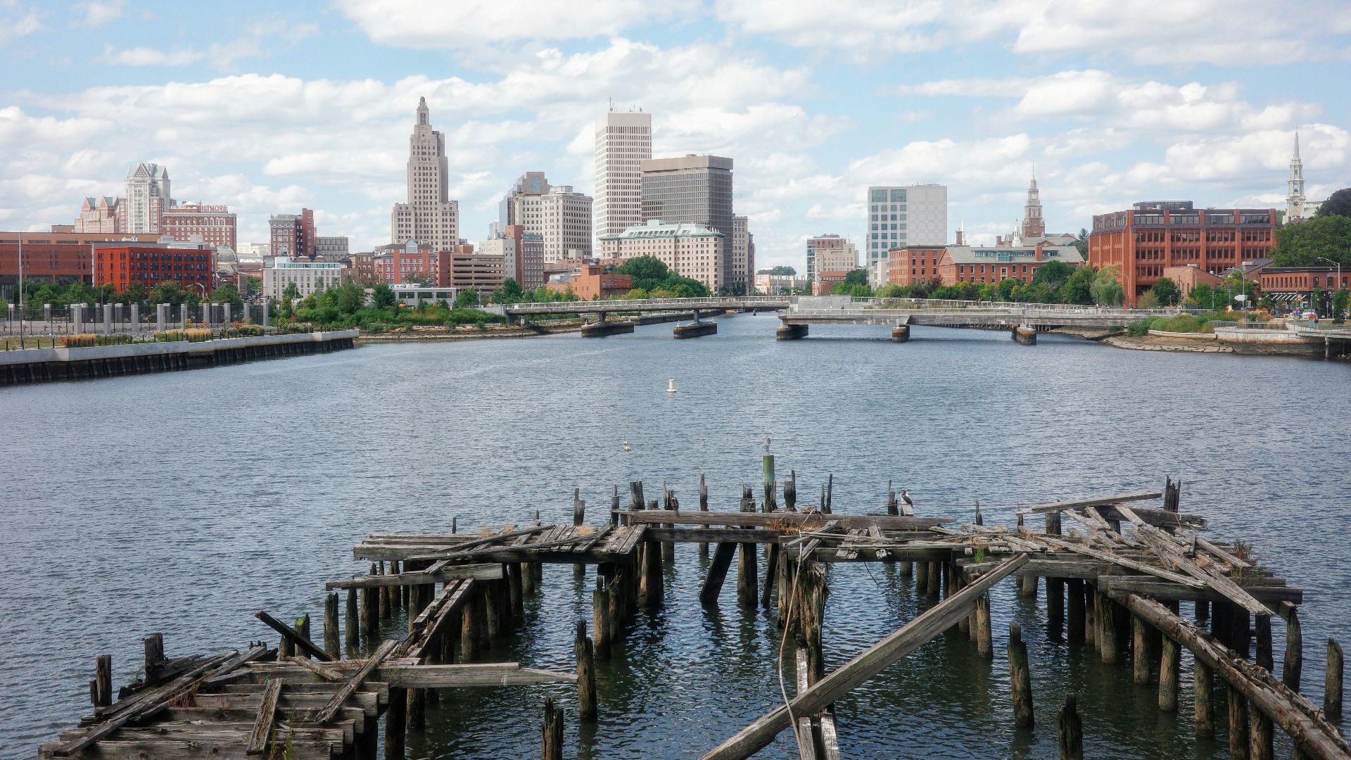 A large body of water with a city in the background