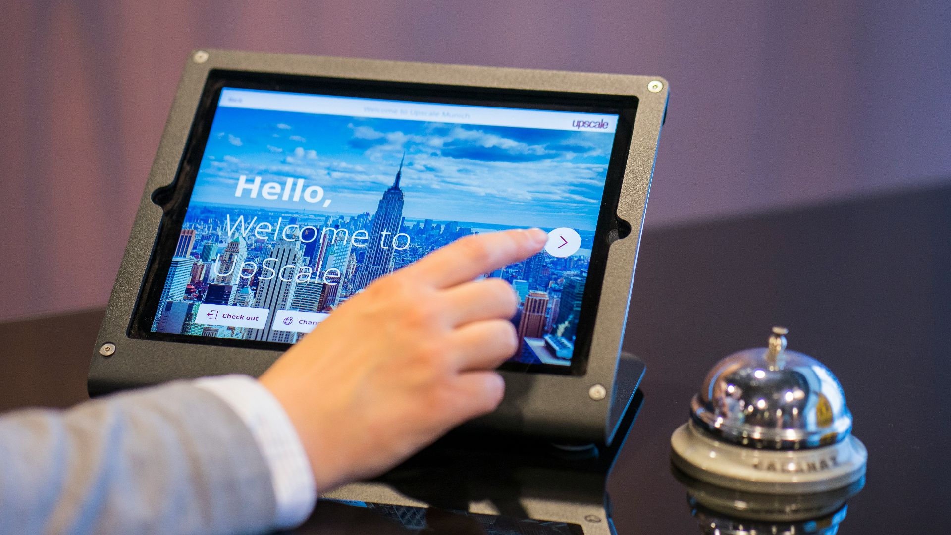 person about to touch black Android tablet computer