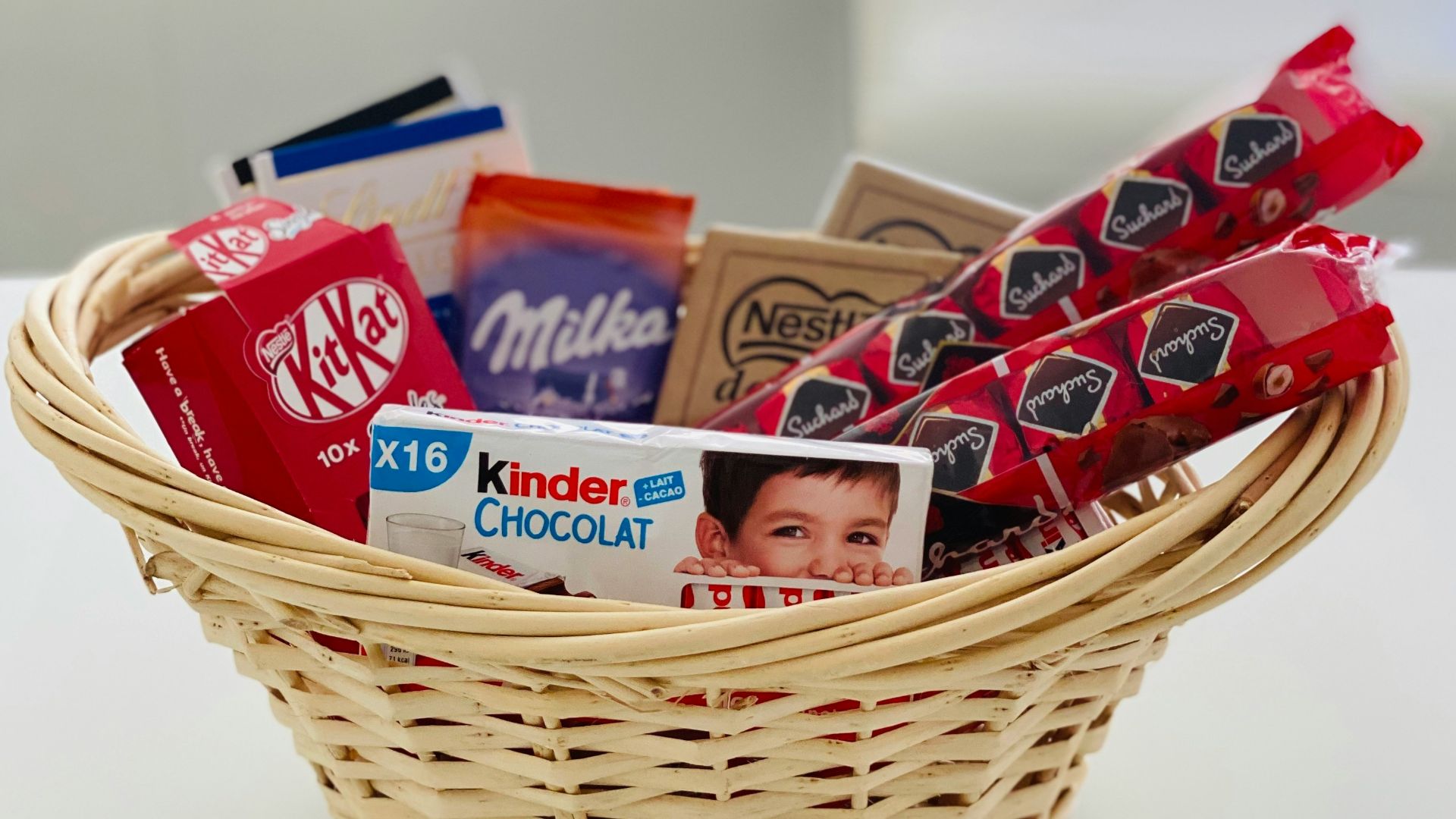 red and white plastic packs in brown woven basket