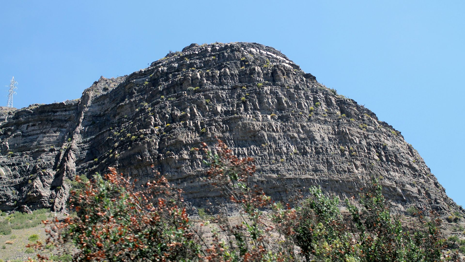 gray rocky mountain under blue sky during daytime