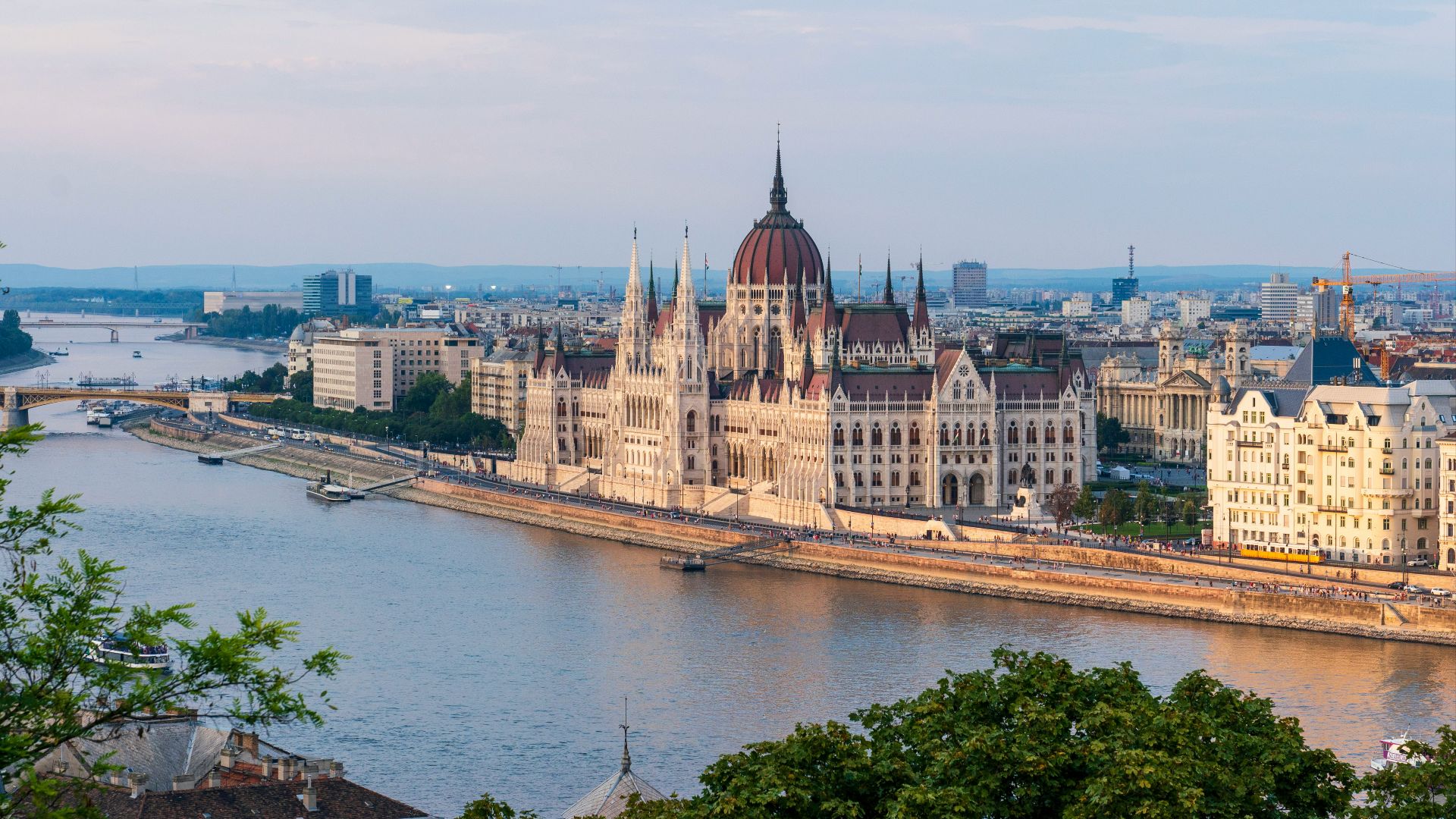 brown concrete building near body of water during daytime