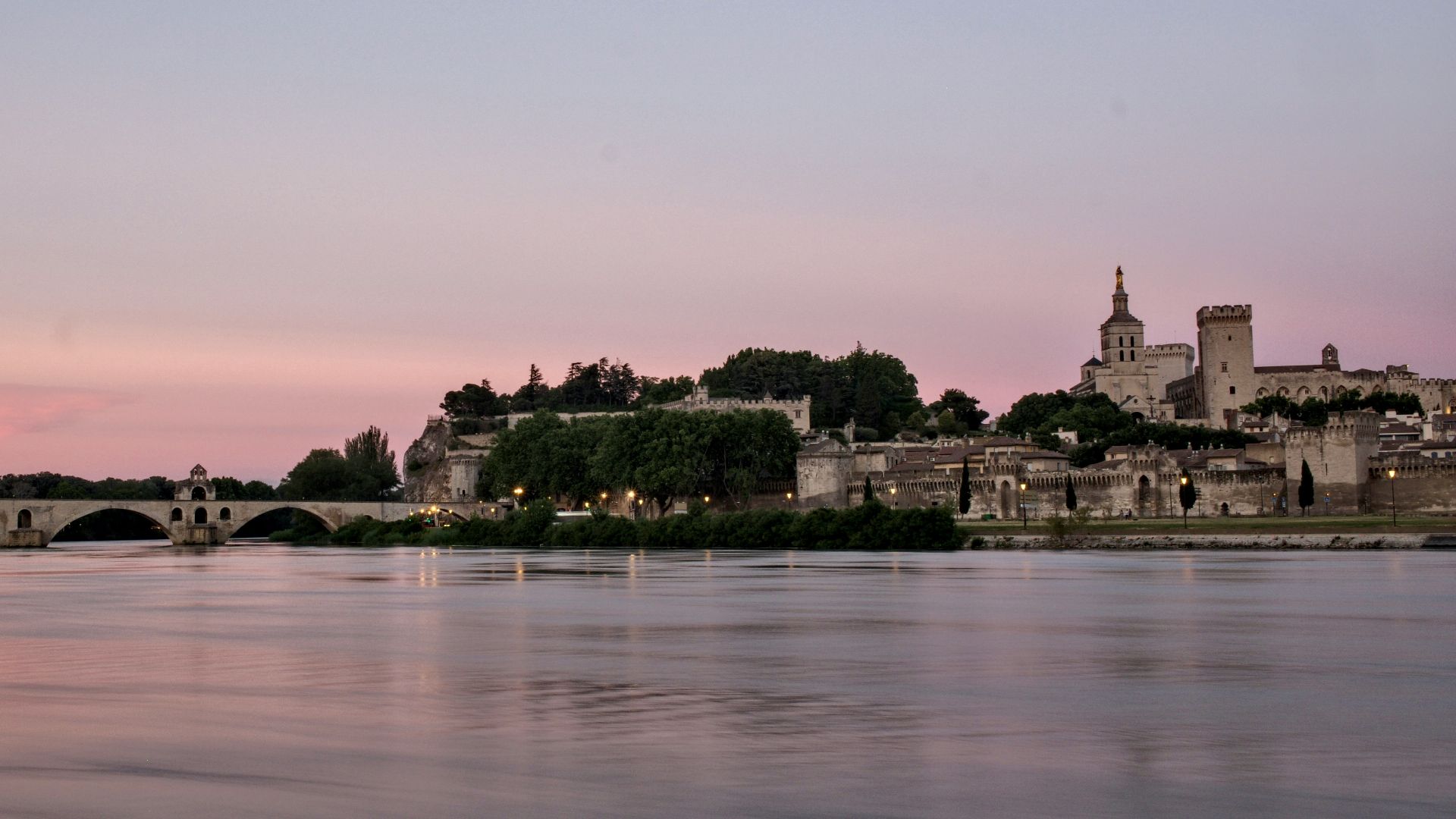 body of water near trees during daytime