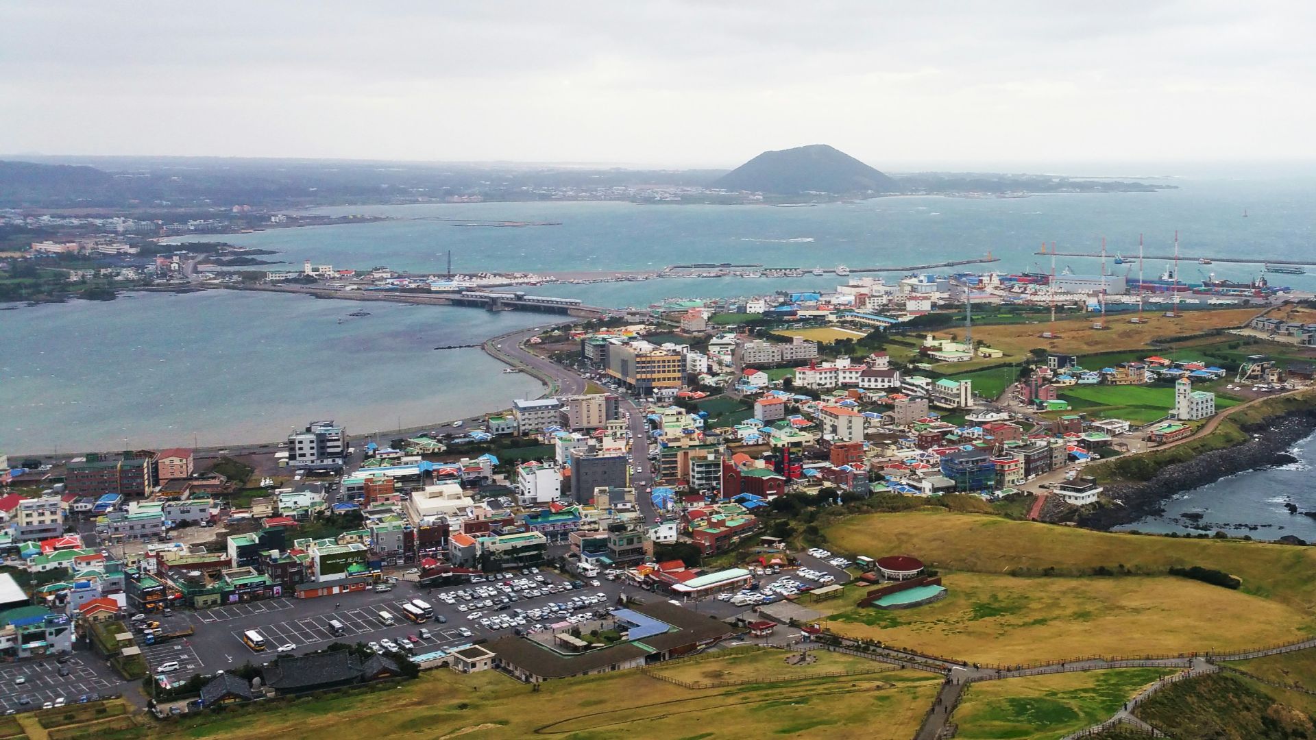 aerial view of city near body of water during daytime