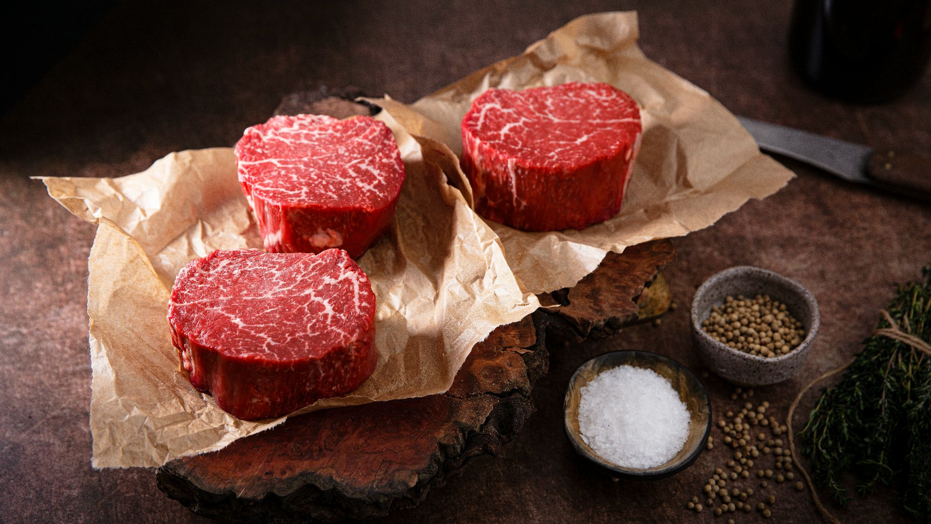 sliced meat on brown paper