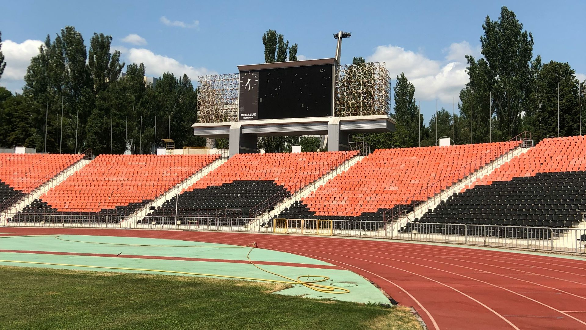 red and white soccer field under blue sky during daytime