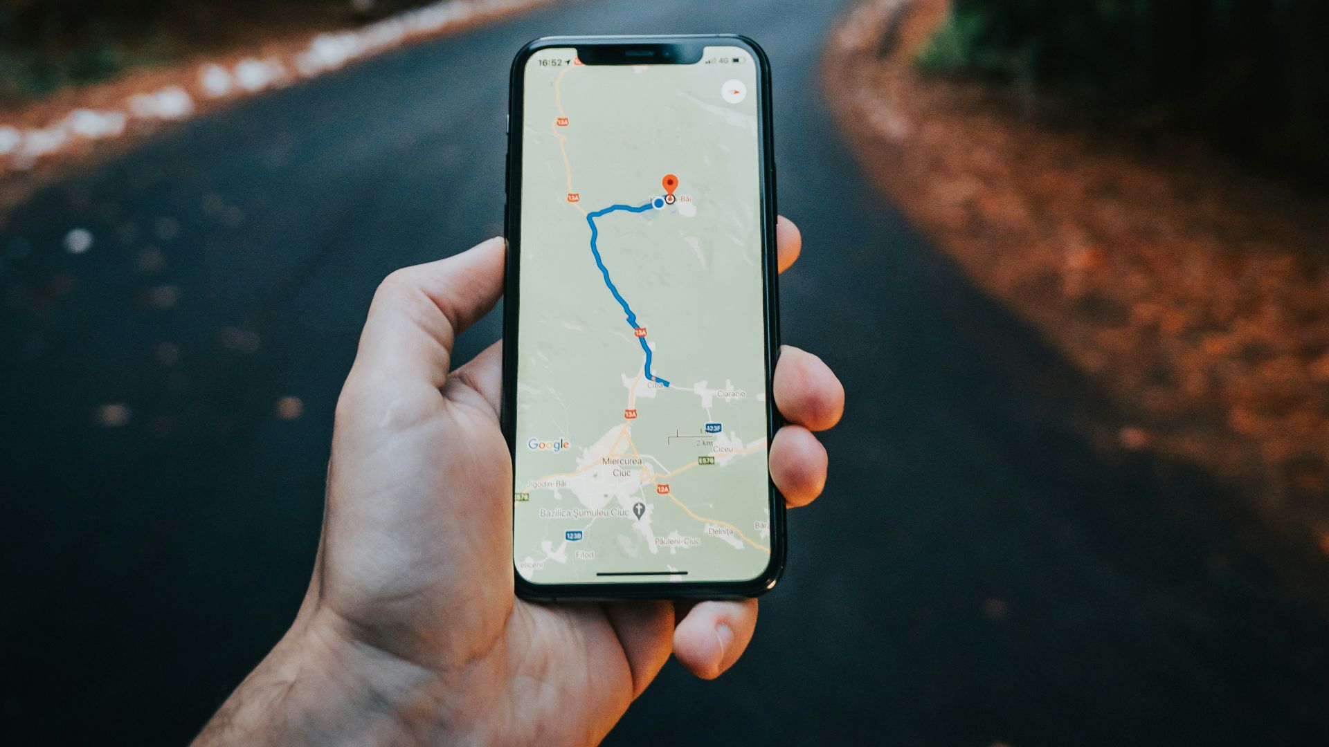 person holding white iphone 5 c