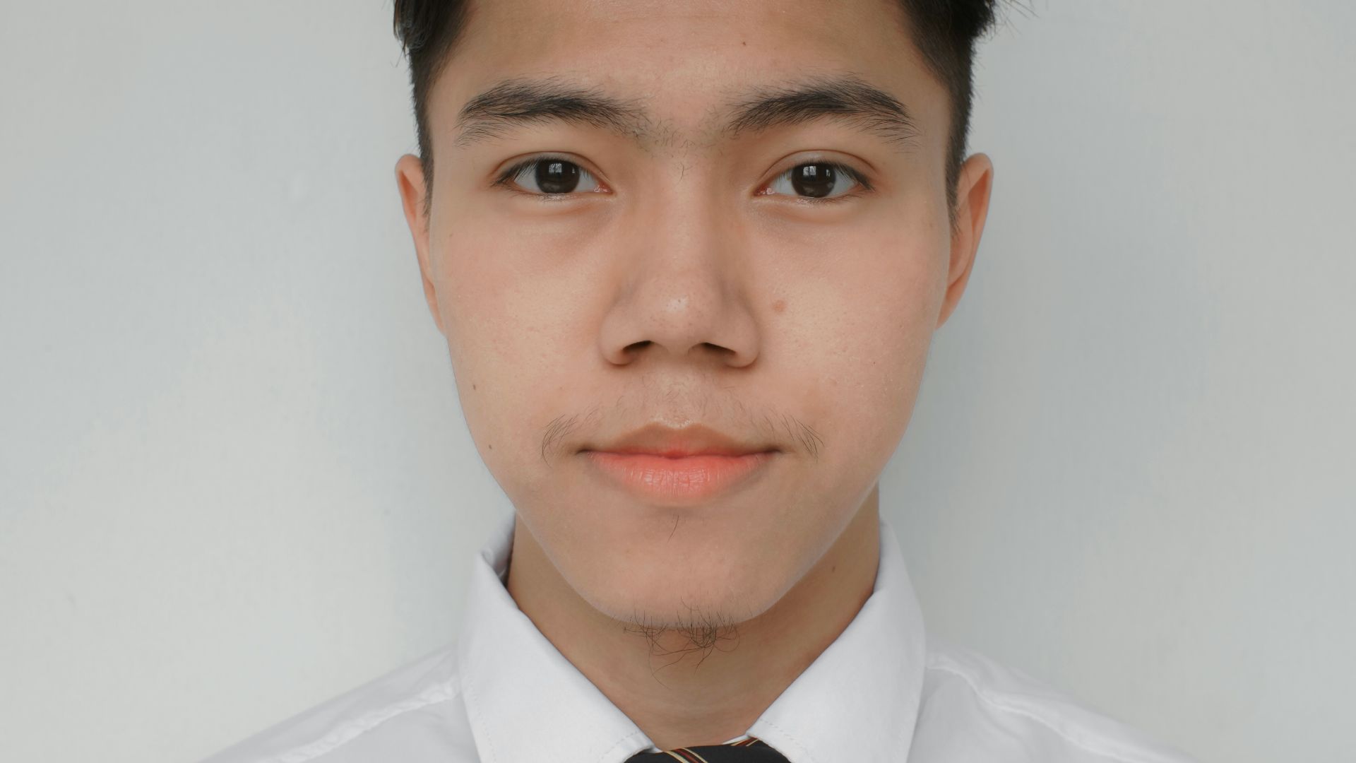 a man wearing a white shirt and a tie