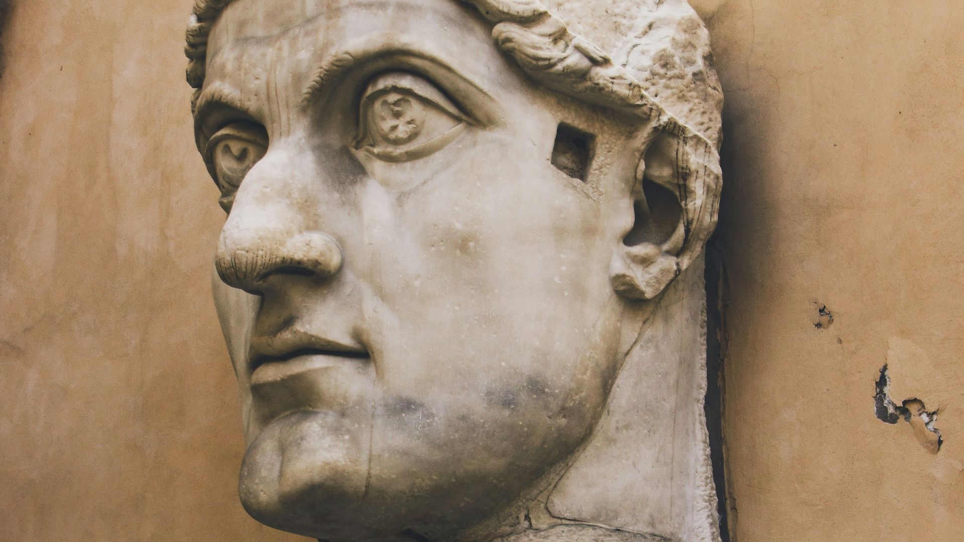 a close up of a statue of a man's head