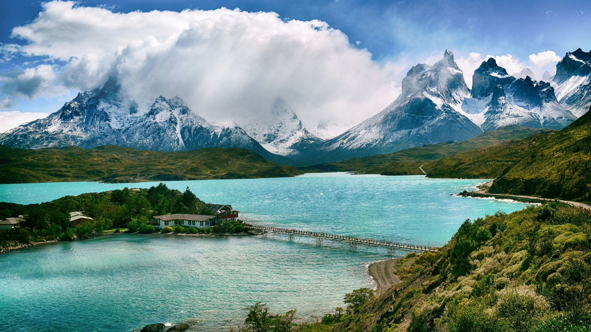 lake near snow-covered mountain during daytime