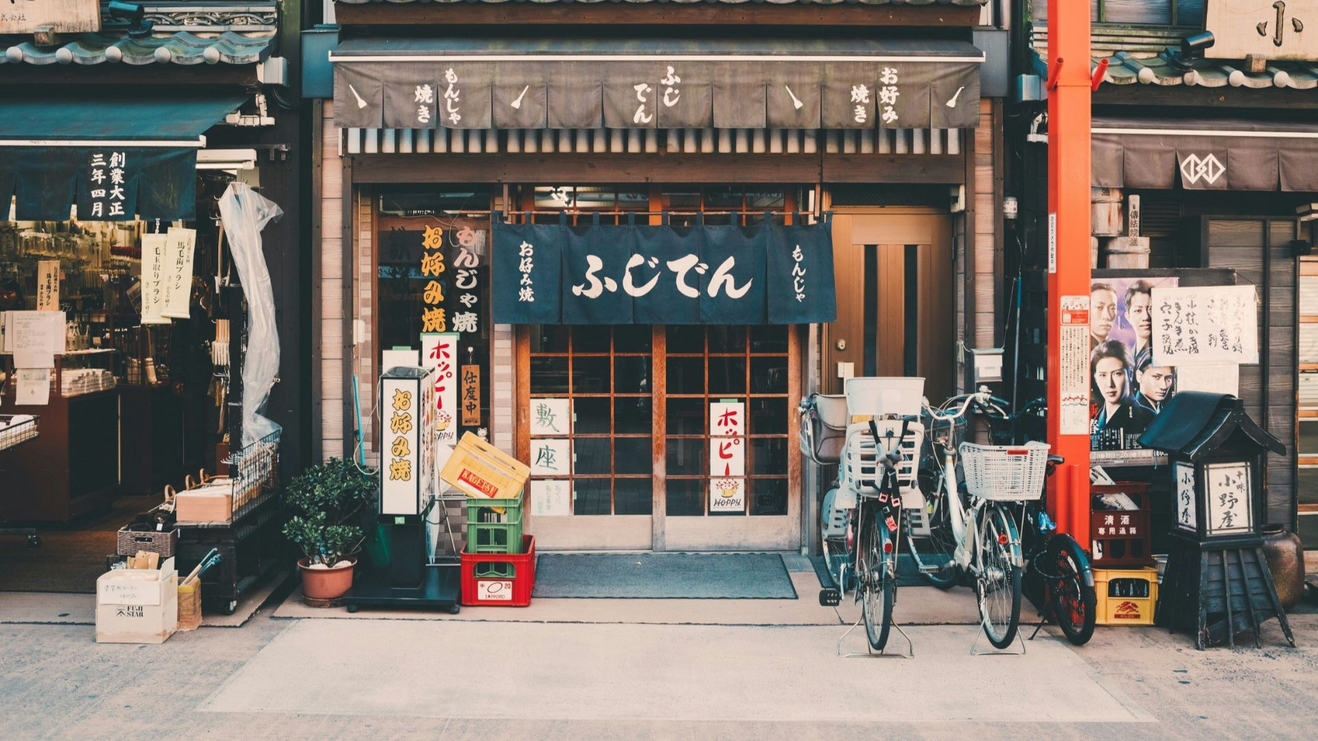 three bicycles parked in front of building