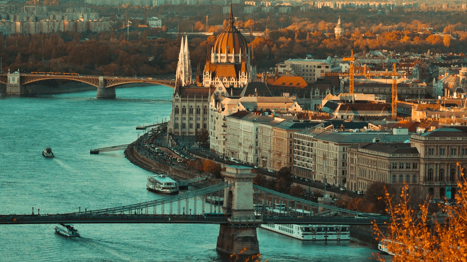 view of gray building near body of water