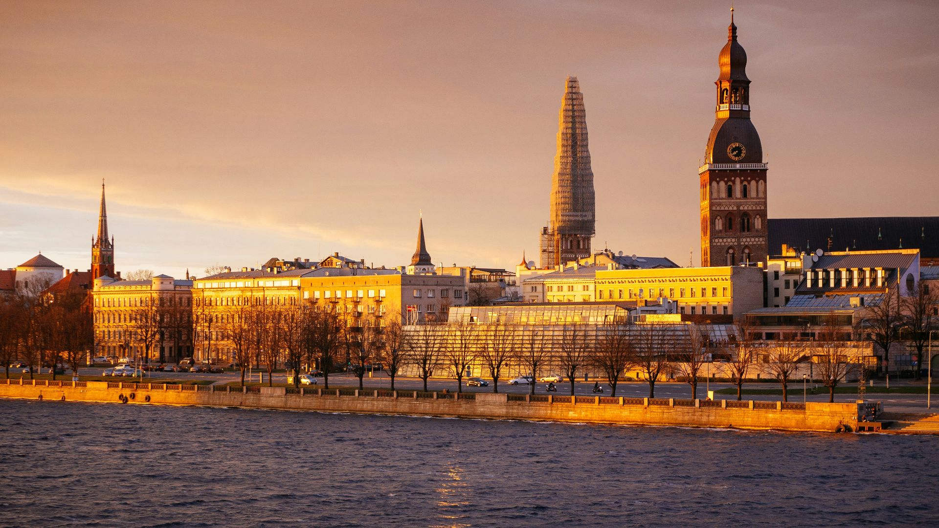 brown and white concrete building near body of water during daytime