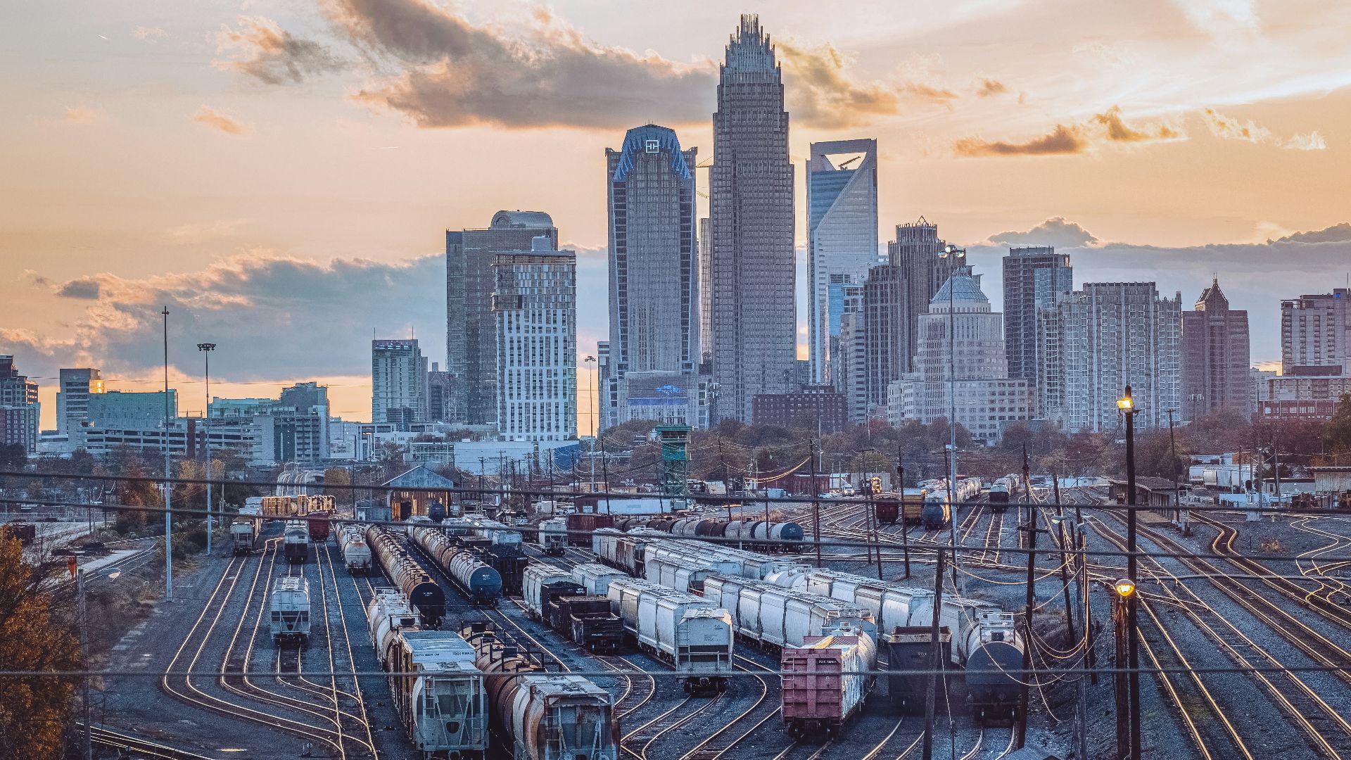a train yard with many trains on the tracks
