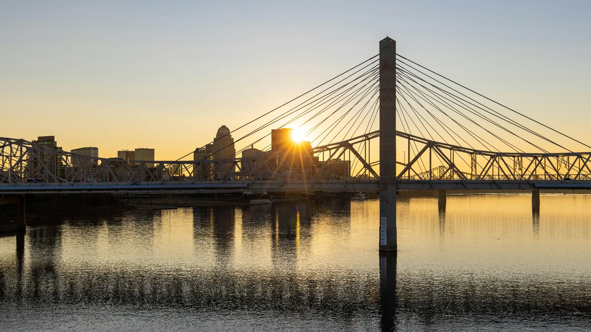 bridge over water during sunset