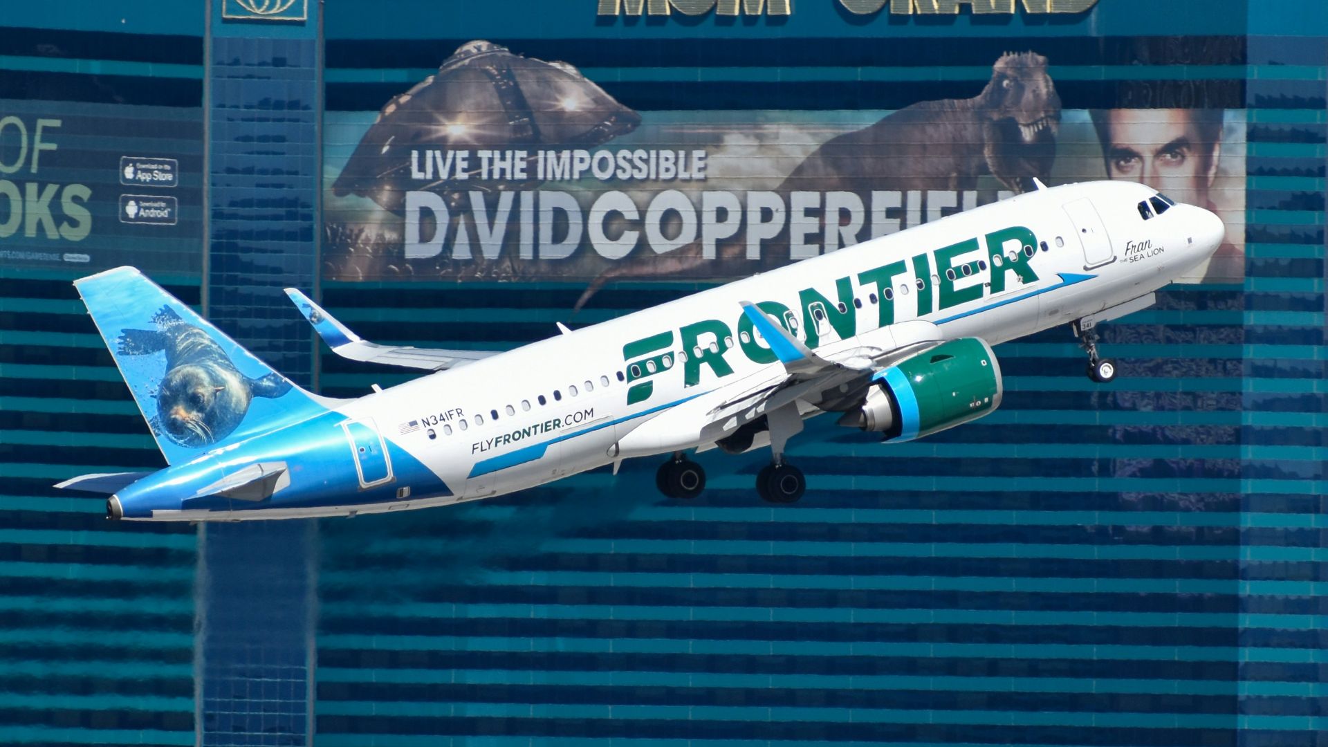 A large passenger jet flying over the las vegas strip